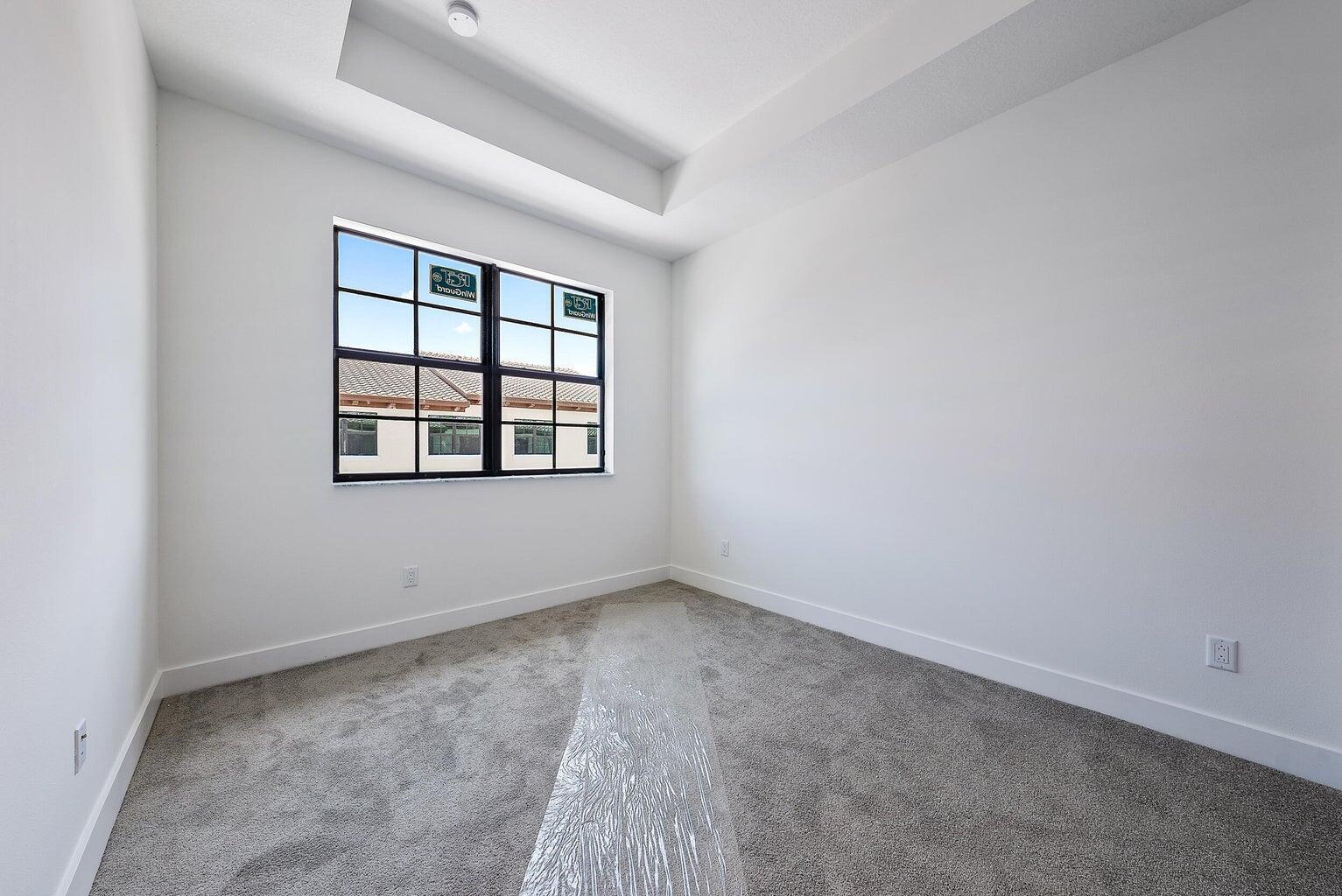 5264 Beckman Terrace Palm Beach Gardens, FL 33418 - Photo 12 of 12 an empty room with a window