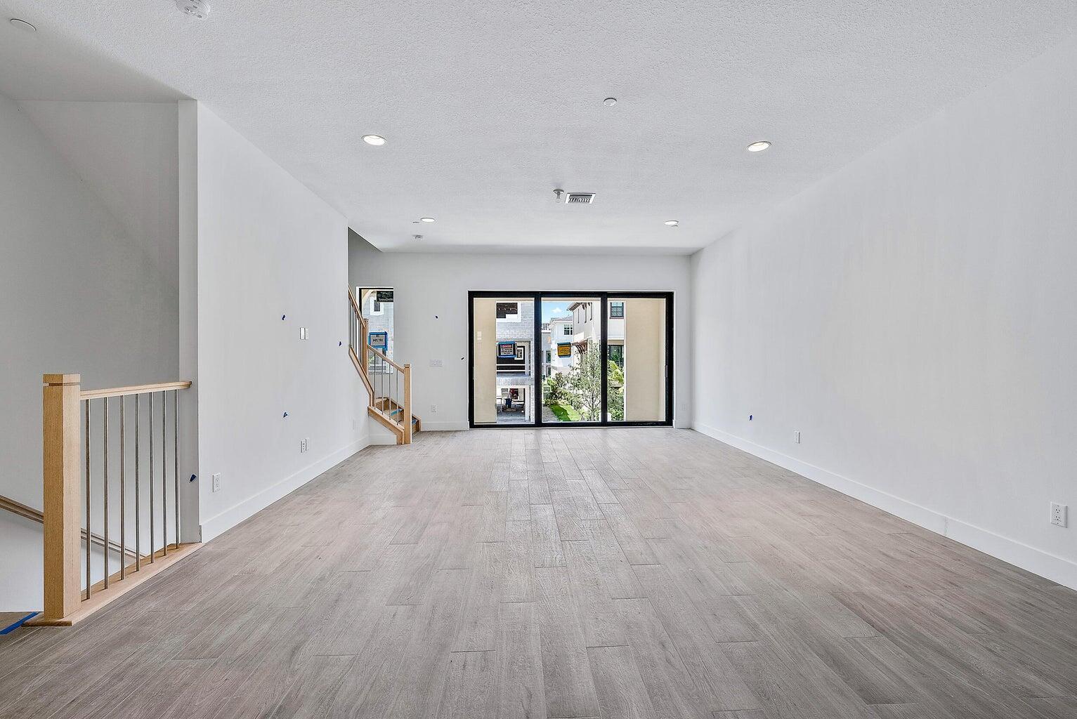 5264 Beckman Terrace Palm Beach Gardens, FL 33418 - Photo 5 of 12 a view of an empty room with a window