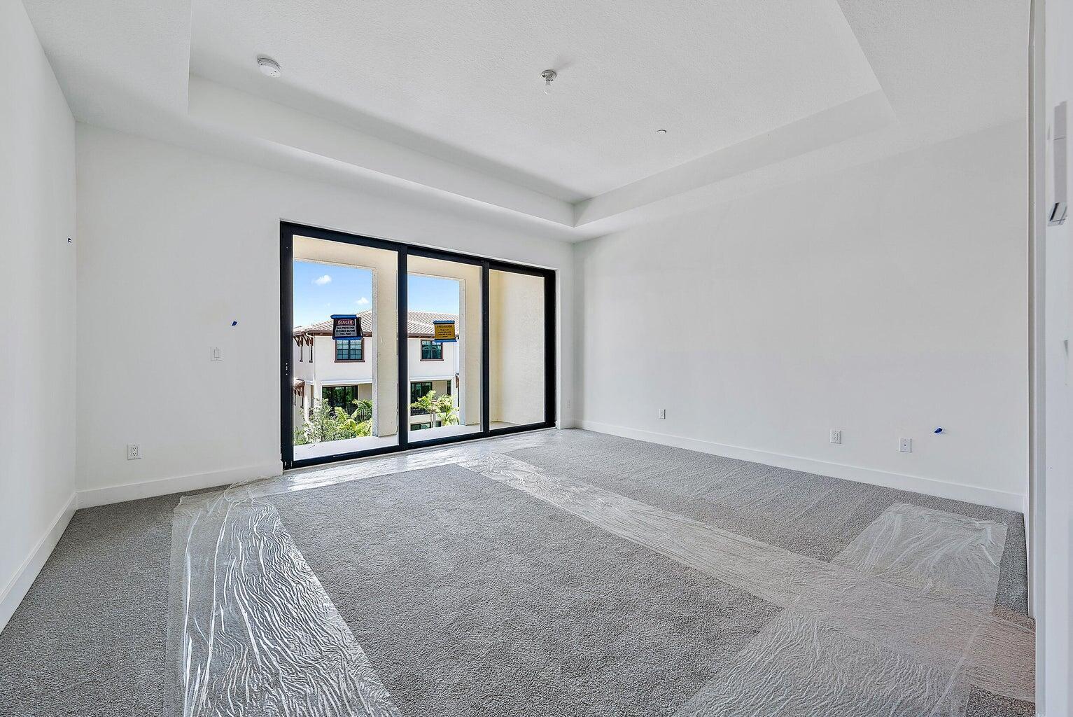 5264 Beckman Terrace Palm Beach Gardens, FL 33418 - Photo 6 of 12 an empty room with windows