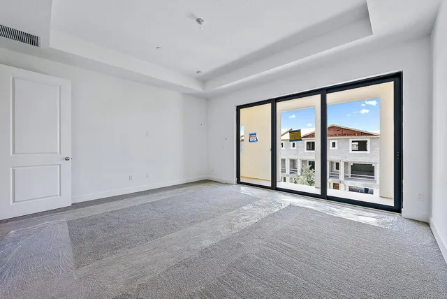 a view of an empty room with a balcony