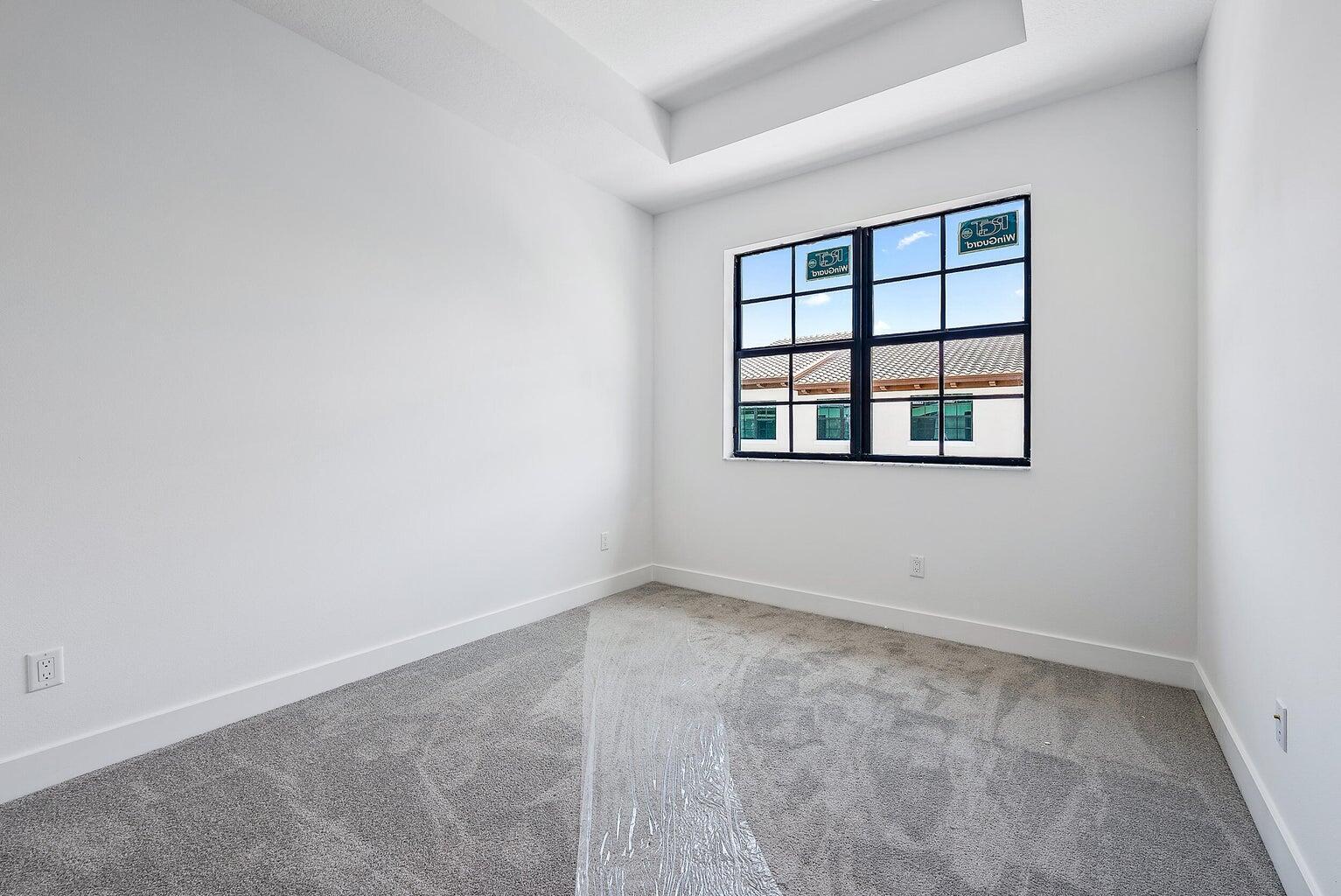 5264 Beckman Terrace Palm Beach Gardens, FL 33418 - Photo 10 of 12 an empty room with a window