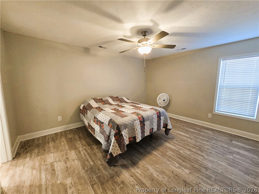 422 Mitchell Farm Road Goldsboro, NC 27530 - Photo 23 of 28 a bedroom with a bed and window