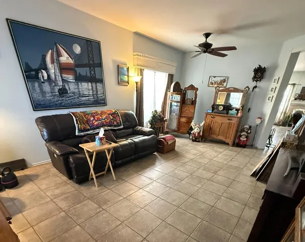 a living room with furniture and stairs