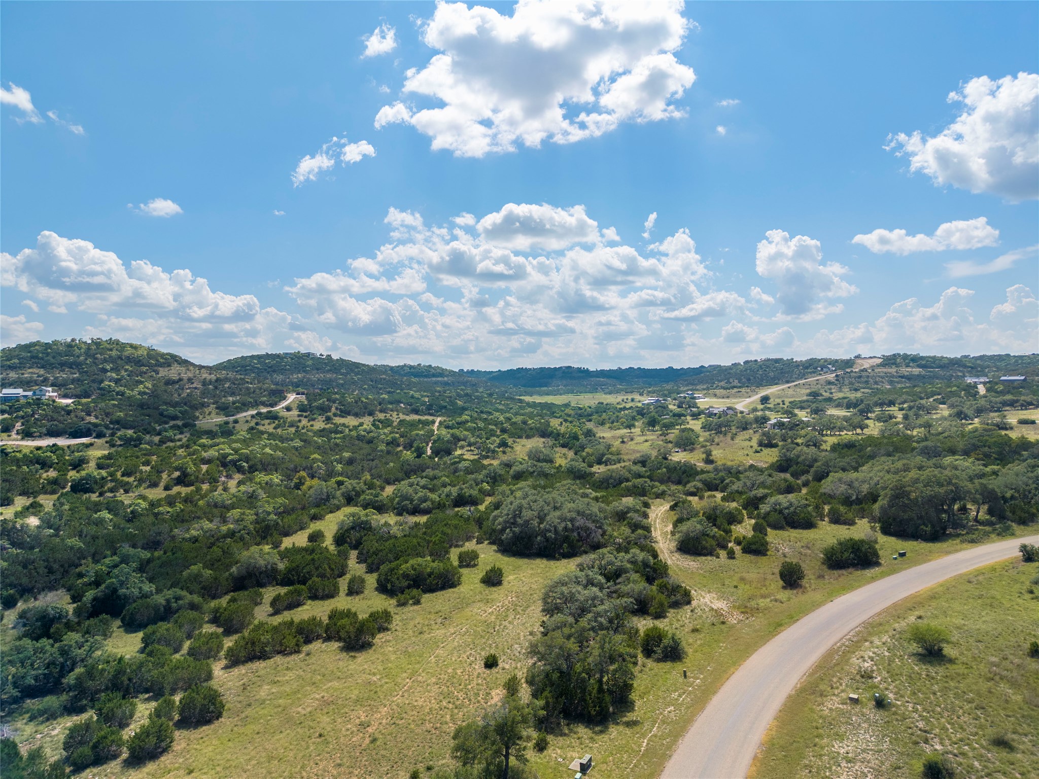 717 Bluff Ridge Trail Blanco, TX 78606 - Photo 9 of 21 Vast natural landscapes with rolling hills offer a secluded retreat.