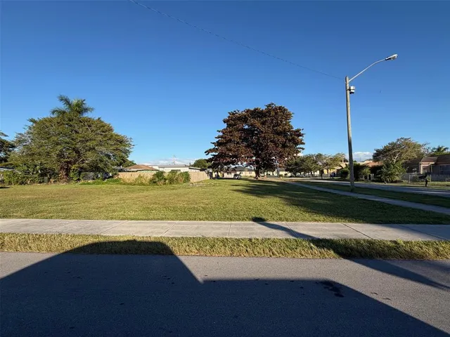a view of an ocean with a floor to ceiling window