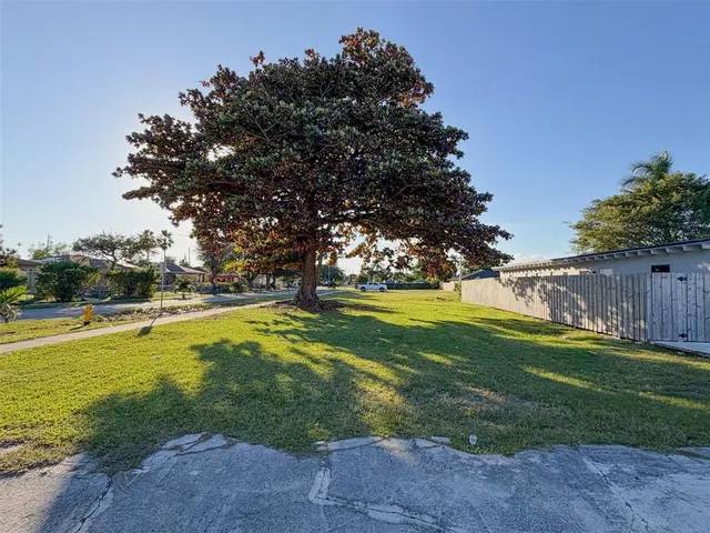 a view of a swimming pool with an outdoor space and seating area
