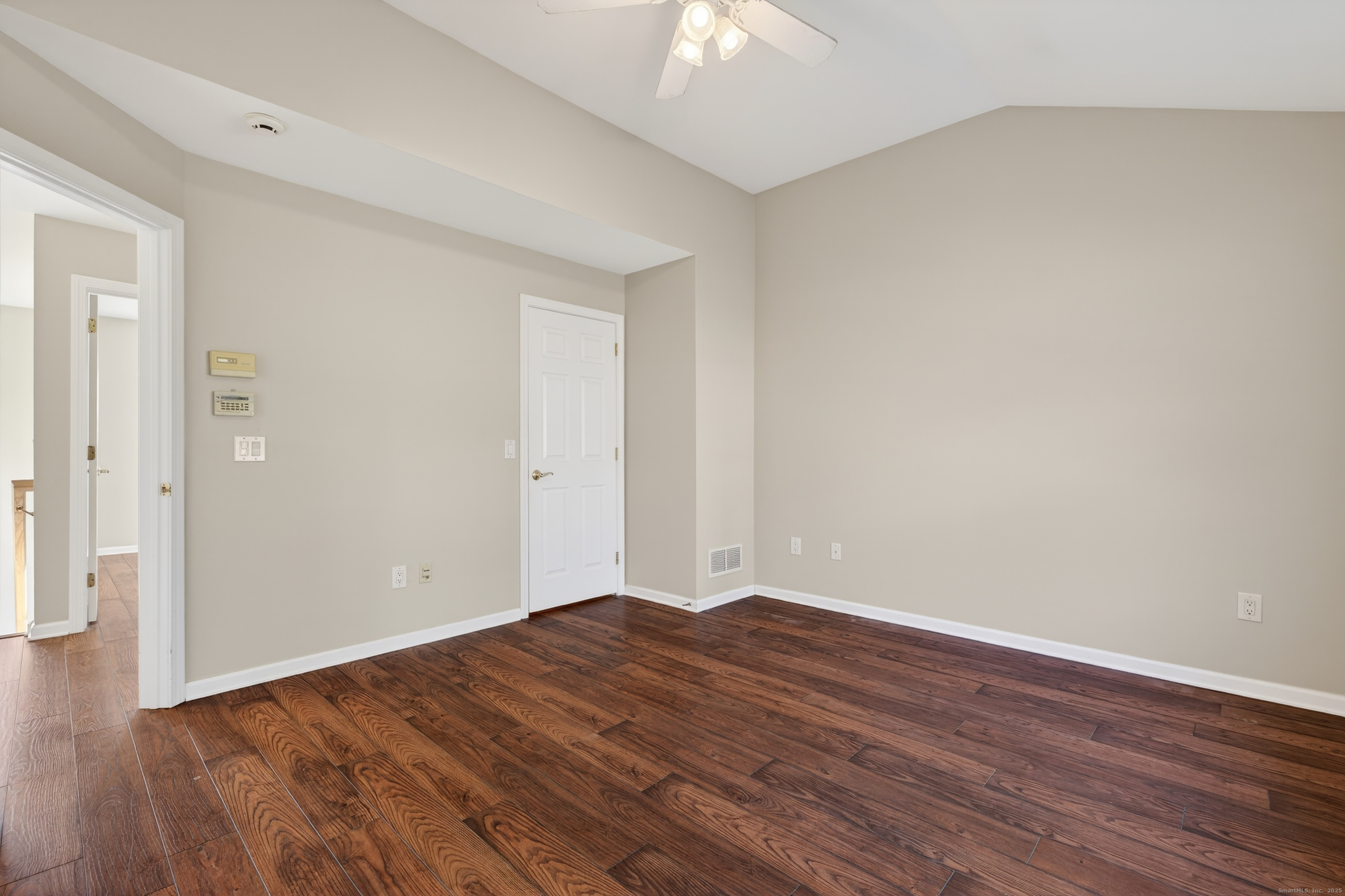 1902 Revere Road, Unit 1902 Danbury, CT 06811 - Photo 11 of 37 a view of an empty room with wooden floor