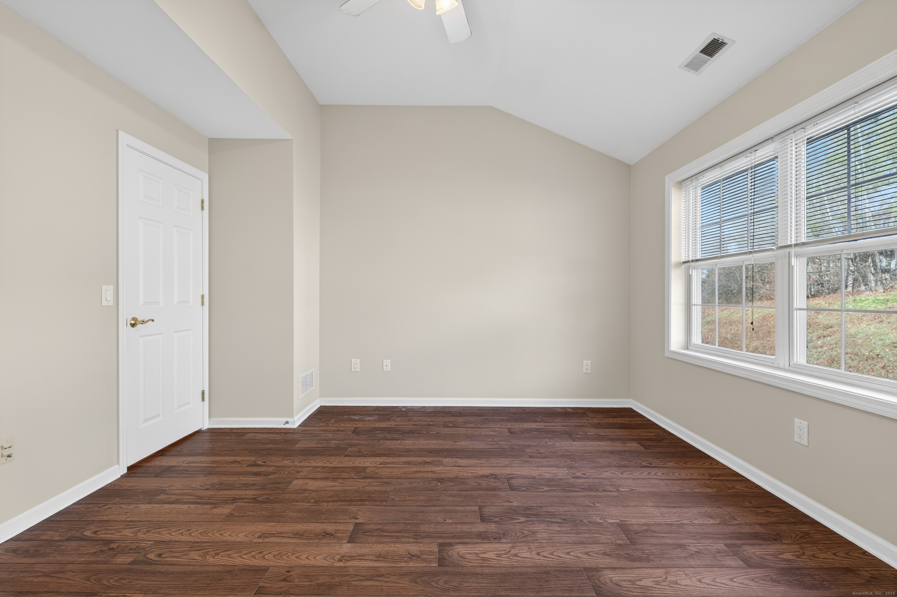 1902 Revere Road, Unit 1902 Danbury, CT 06811 - Photo 15 of 37 an empty room with wooden floor and windows