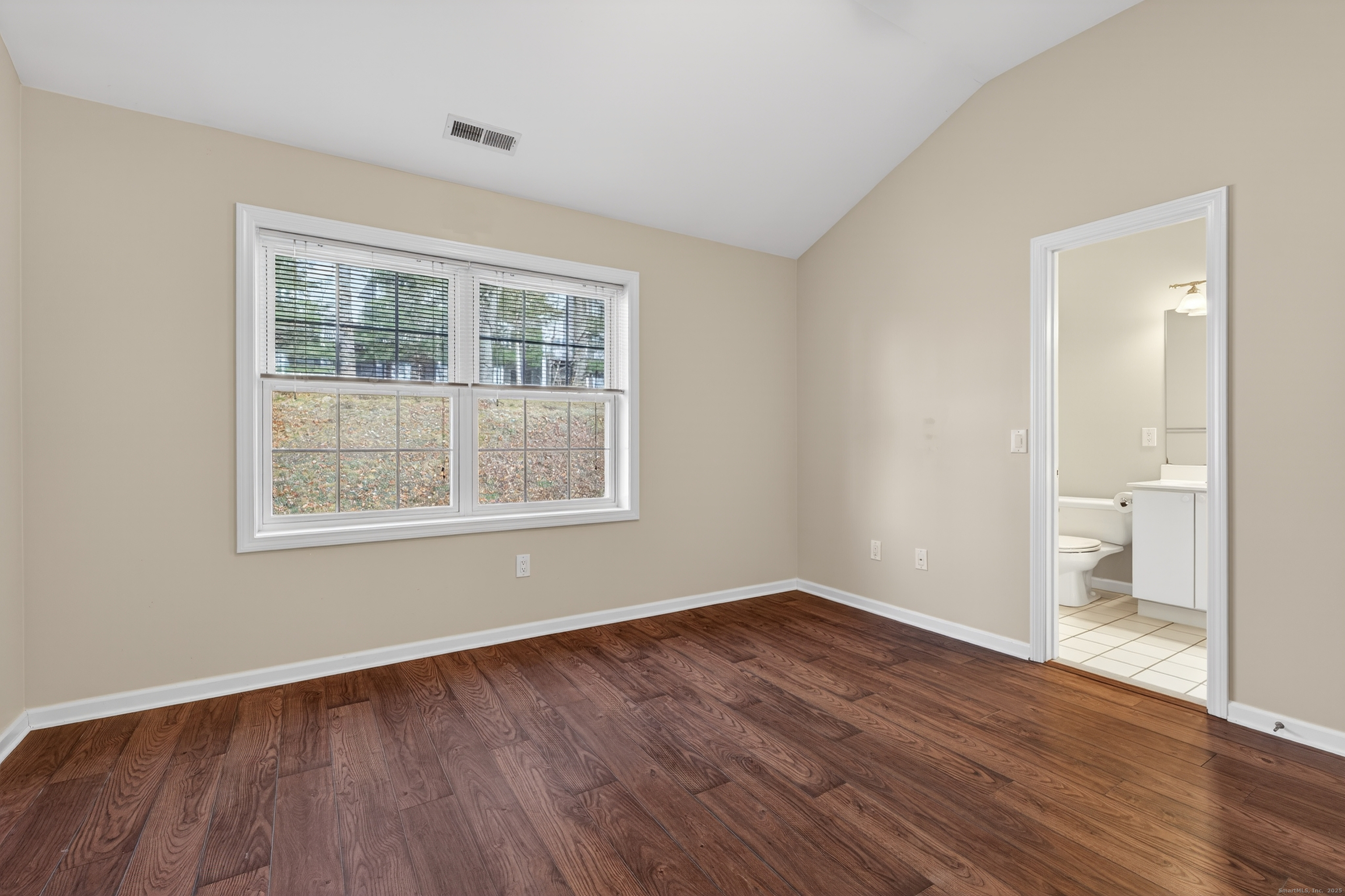 1902 Revere Road, Unit 1902 Danbury, CT 06811 - Photo 19 of 37 a view of an empty room with wooden floor and a window