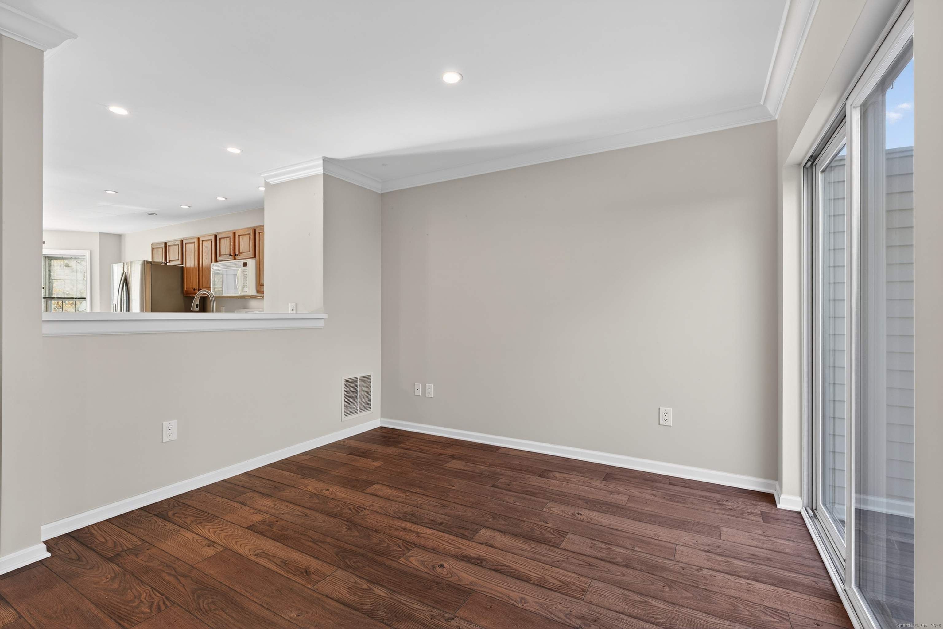 1902 Revere Road, Unit 1902 Danbury, CT 06811 - Photo 20 of 37 a view of a room with wooden floor and a window