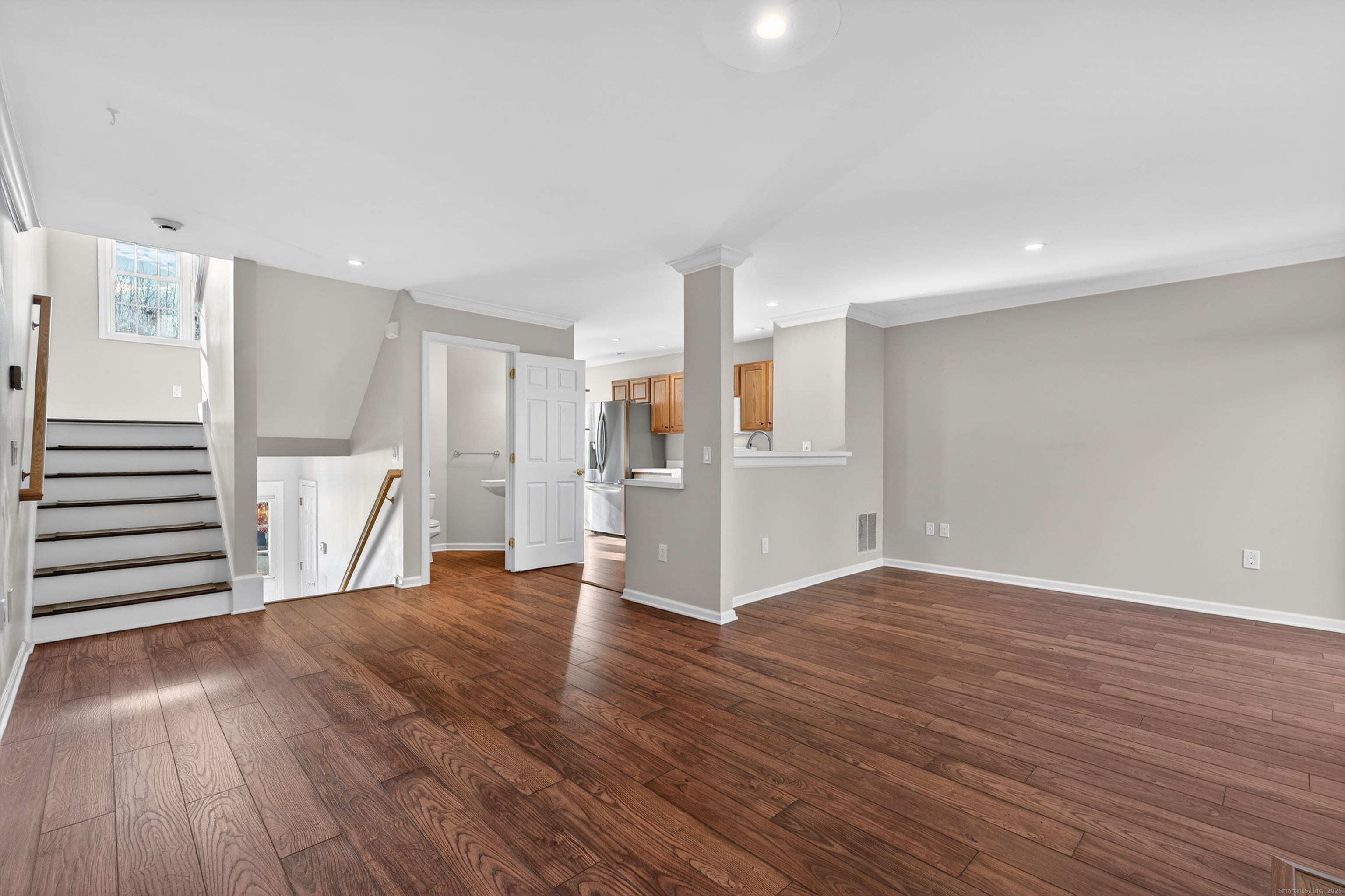 1902 Revere Road, Unit 1902 Danbury, CT 06811 - Photo 2 of 37 a view of empty room with wooden floor