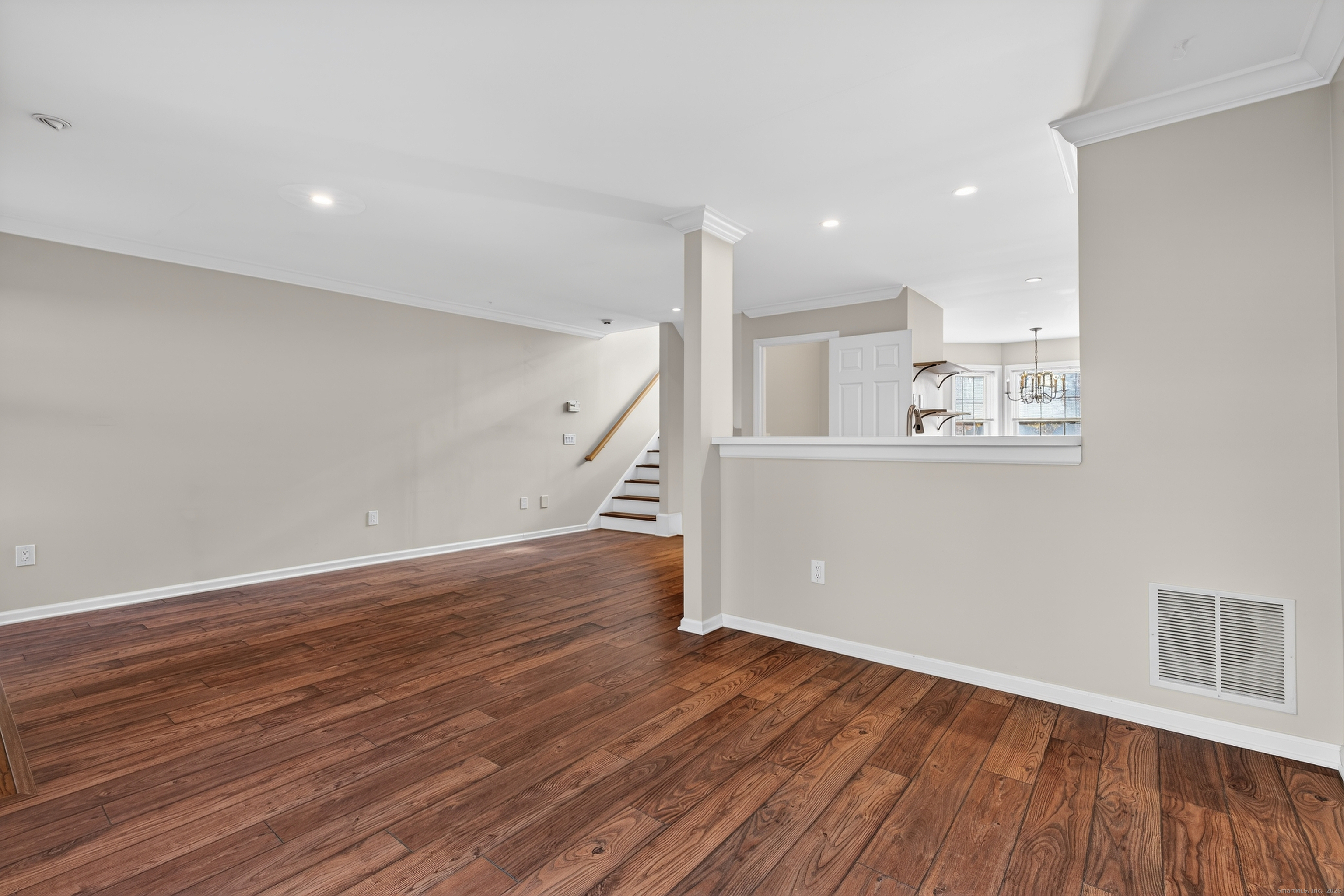 1902 Revere Road, Unit 1902 Danbury, CT 06811 - Photo 21 of 37 an empty room with wooden floor and windows