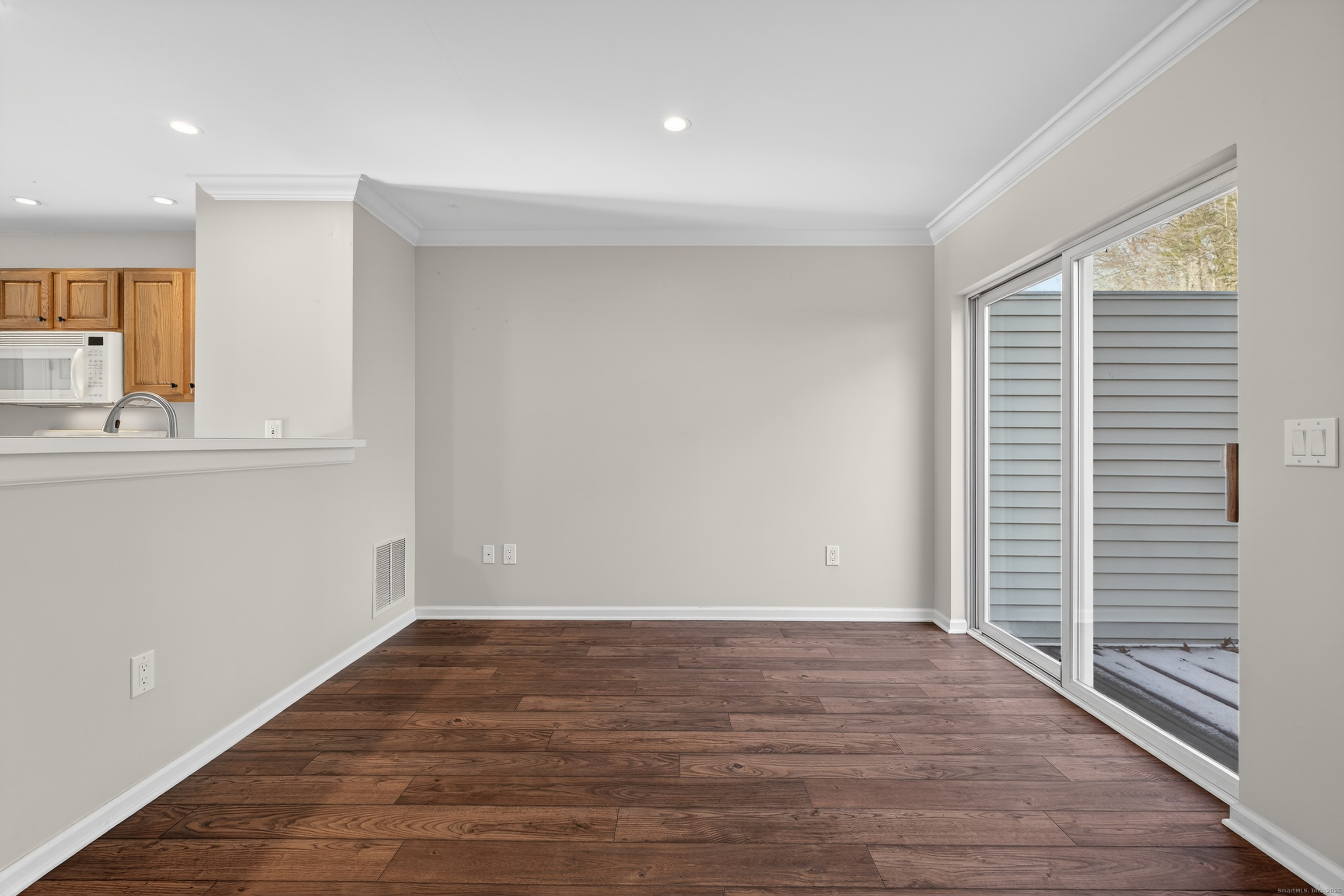 1902 Revere Road, Unit 1902 Danbury, CT 06811 - Photo 22 of 37 wooden floor in an empty room with a window