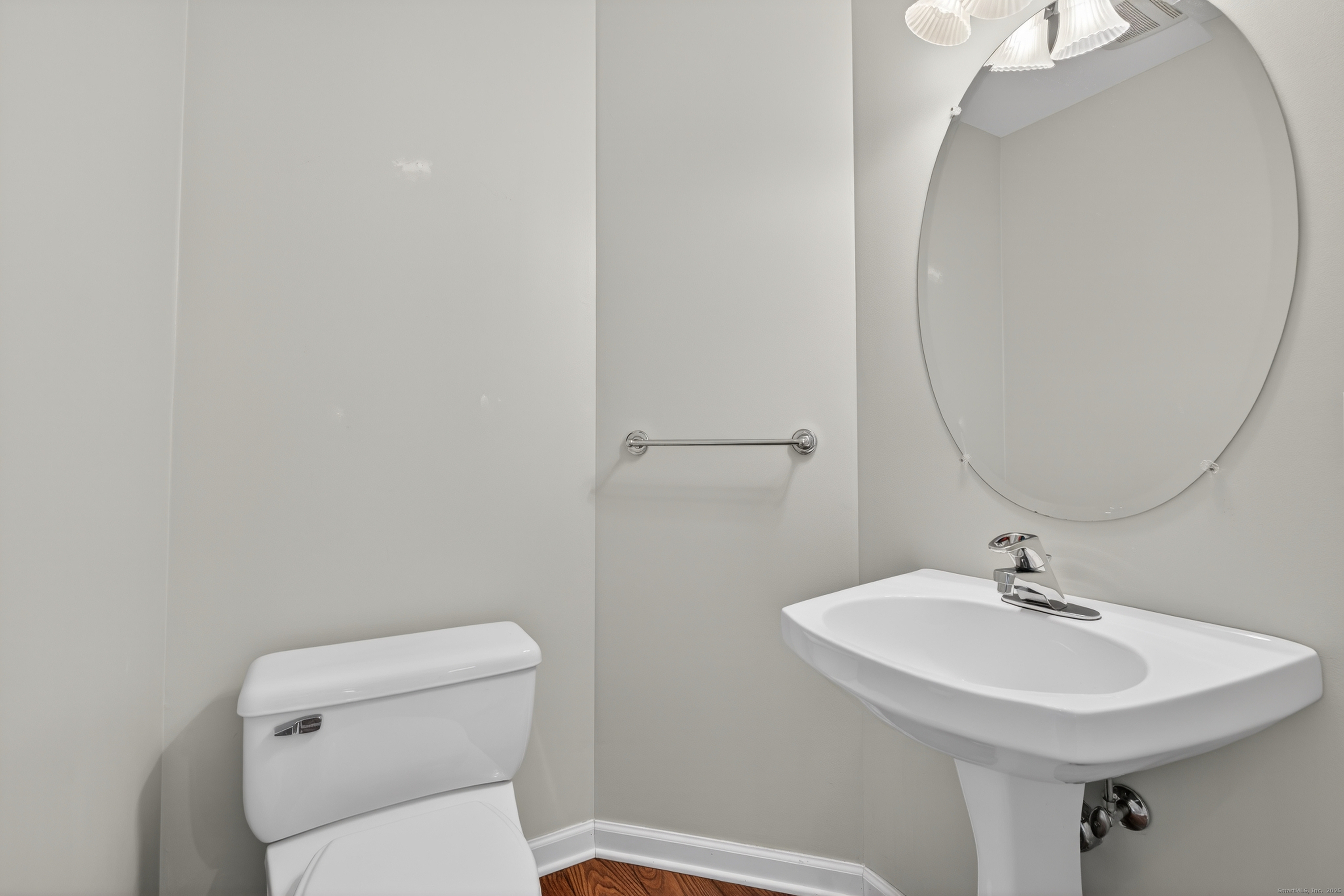 1902 Revere Road, Unit 1902 Danbury, CT 06811 - Photo 23 of 37 a bathroom with a sink a toilet and a mirror