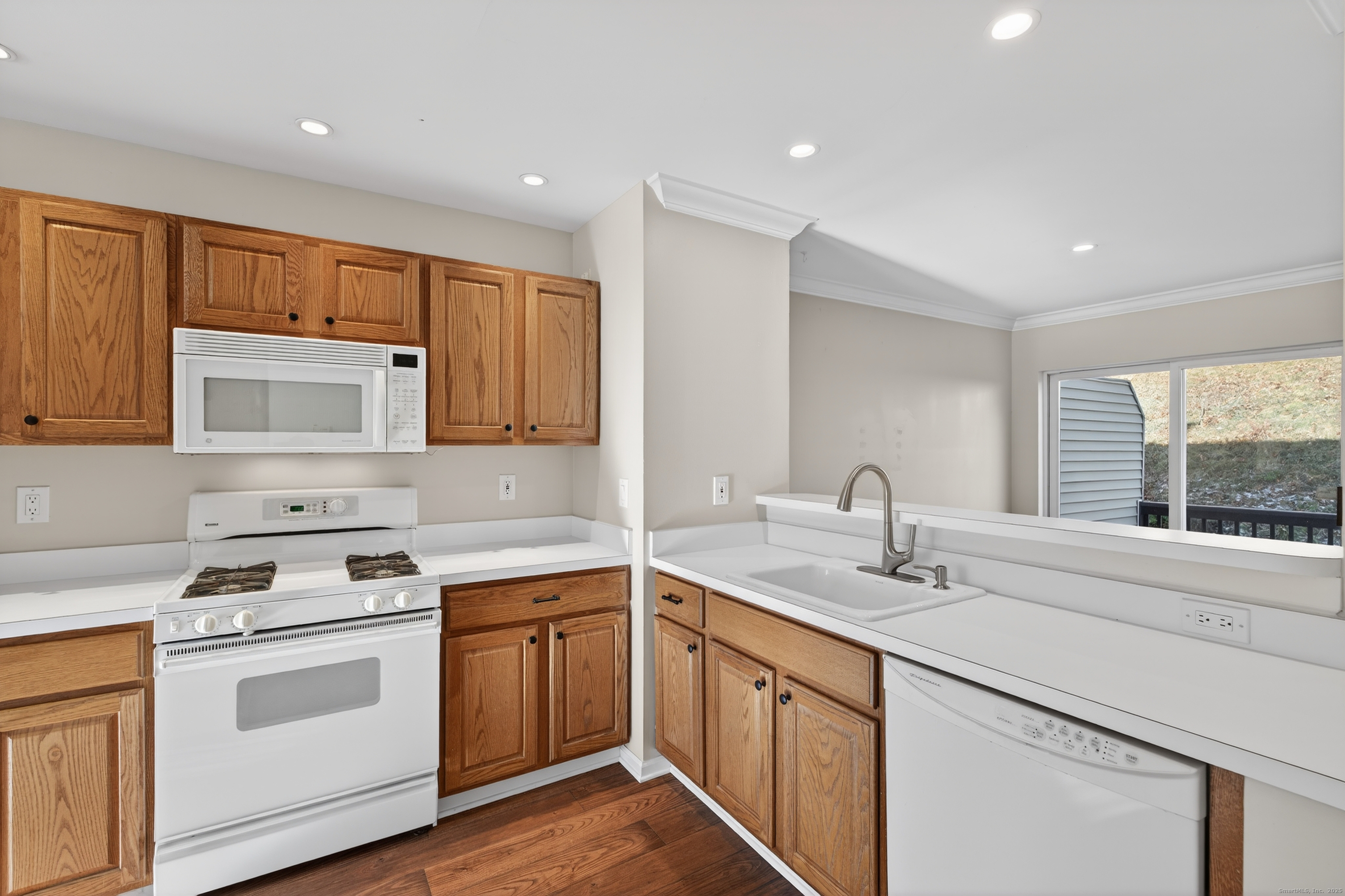 1902 Revere Road, Unit 1902 Danbury, CT 06811 - Photo 24 of 37 a kitchen with a sink stove and cabinets