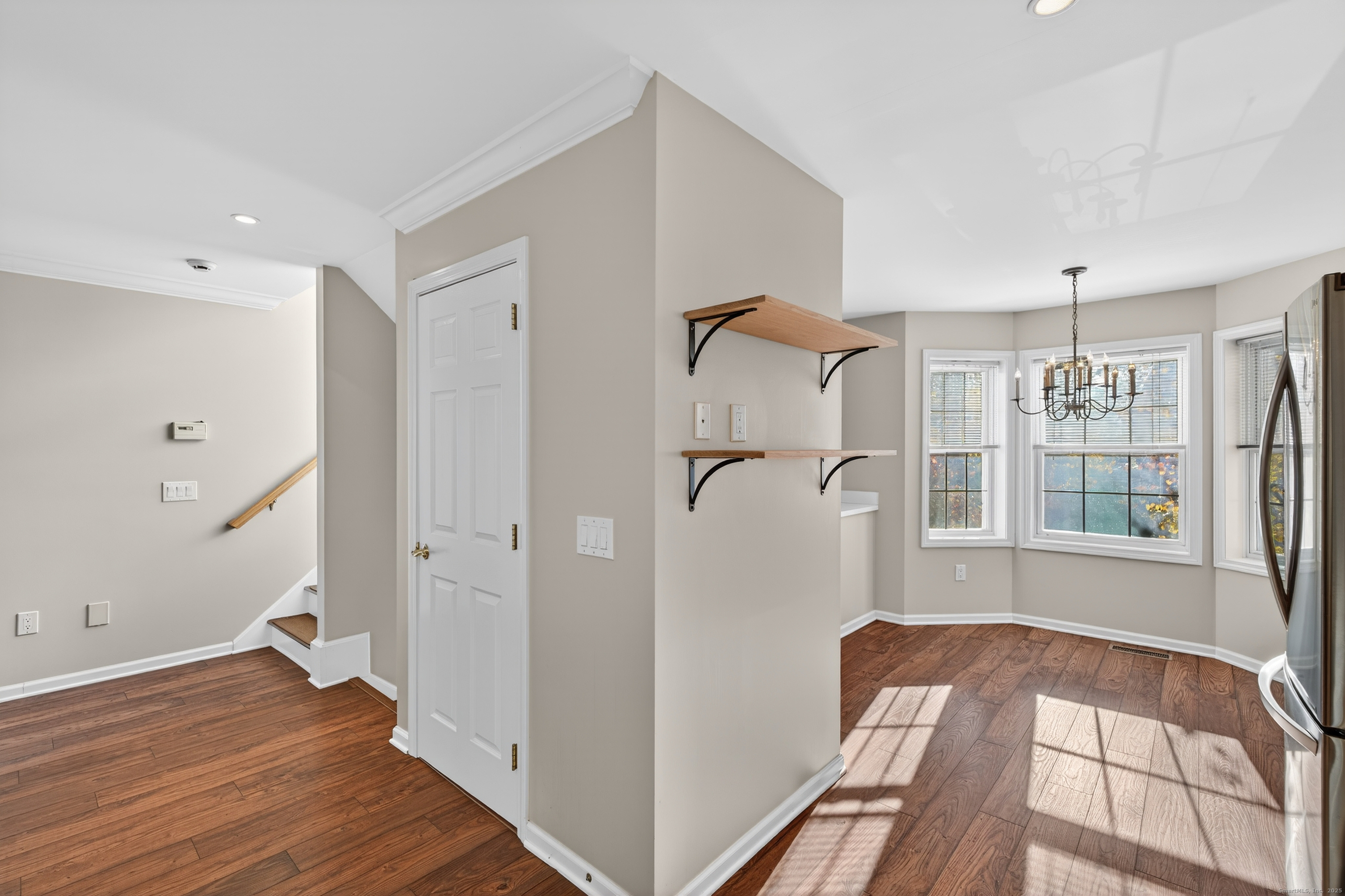 1902 Revere Road, Unit 1902 Danbury, CT 06811 - Photo 25 of 37 a view of a room with wooden floor and windows