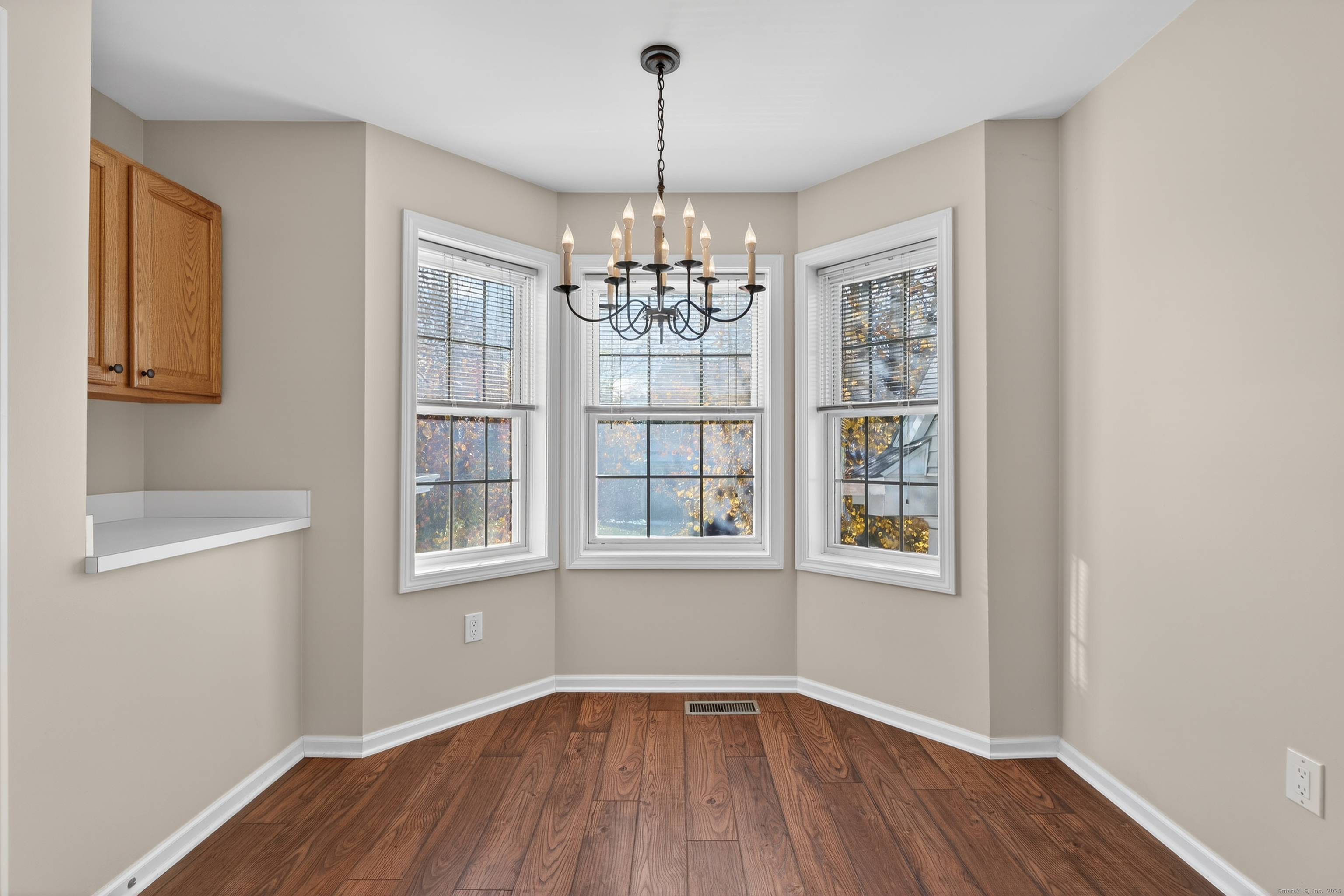 1902 Revere Road, Unit 1902 Danbury, CT 06811 - Photo 26 of 37 wooden floor in an empty room with a window