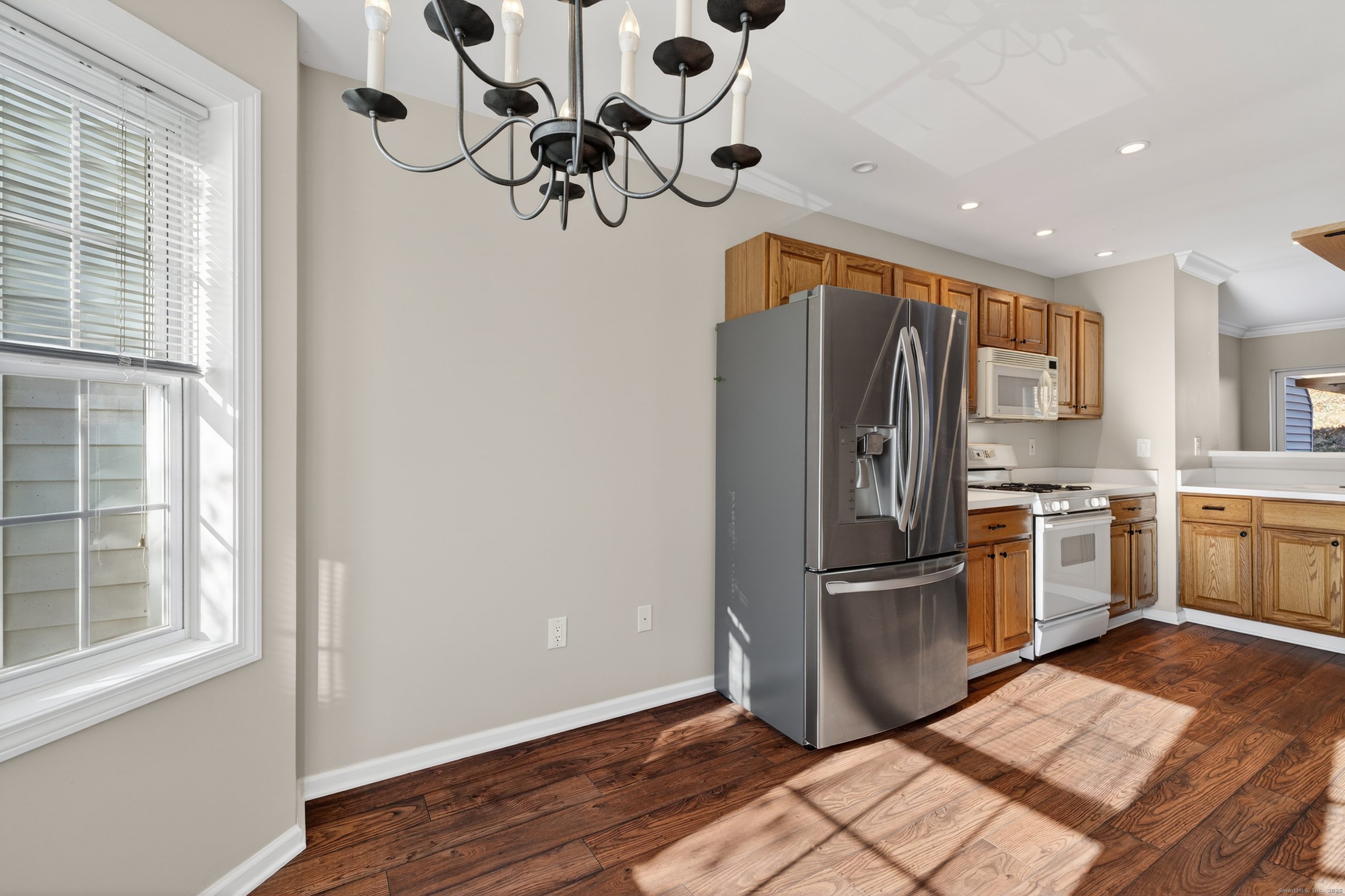 1902 Revere Road, Unit 1902 Danbury, CT 06811 - Photo 27 of 37 a kitchen with stainless steel appliances granite countertop a refrigerator sink and microwave