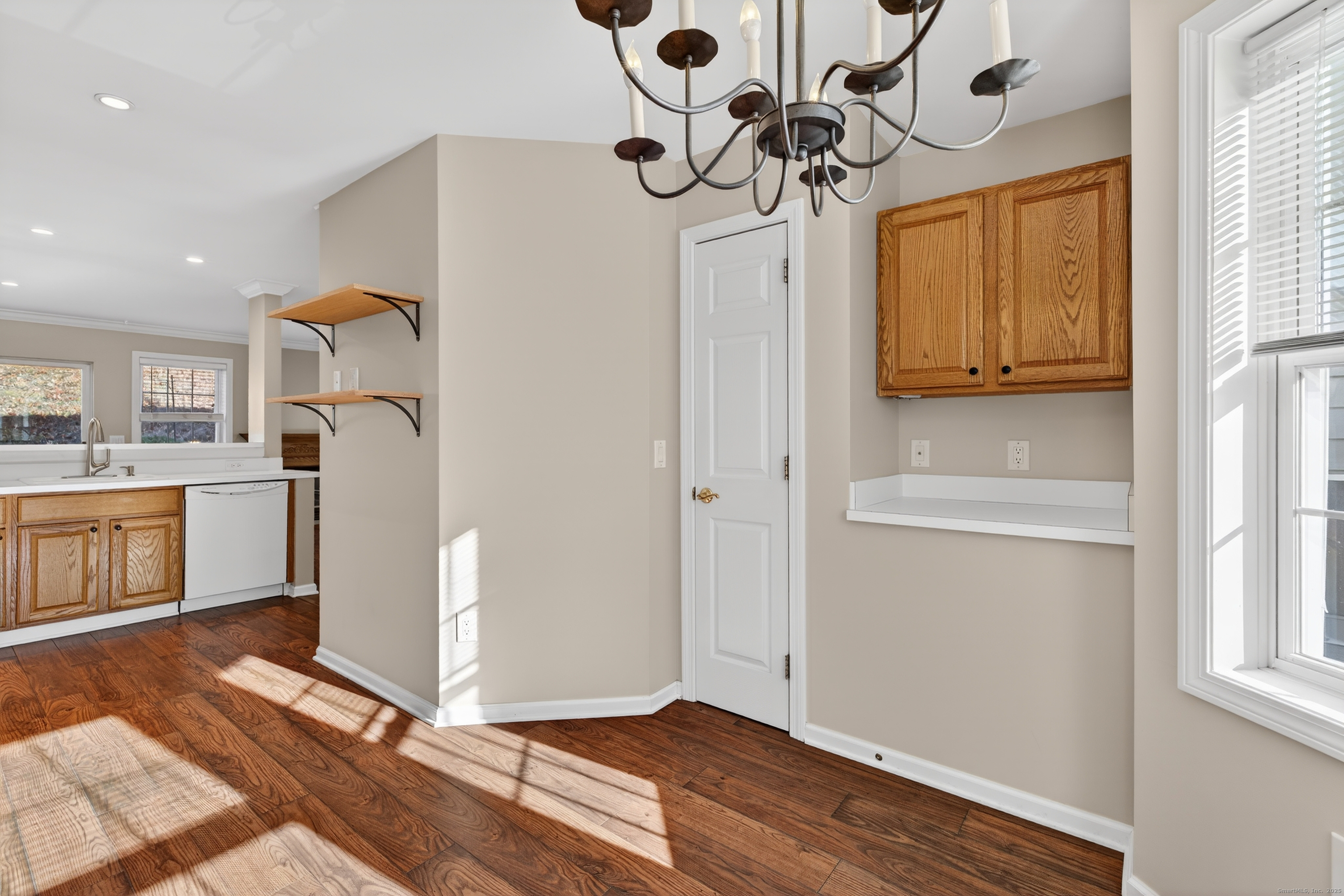 1902 Revere Road, Unit 1902 Danbury, CT 06811 - Photo 28 of 37 a view of a kitchen with a sink dishwasher and wooden floor