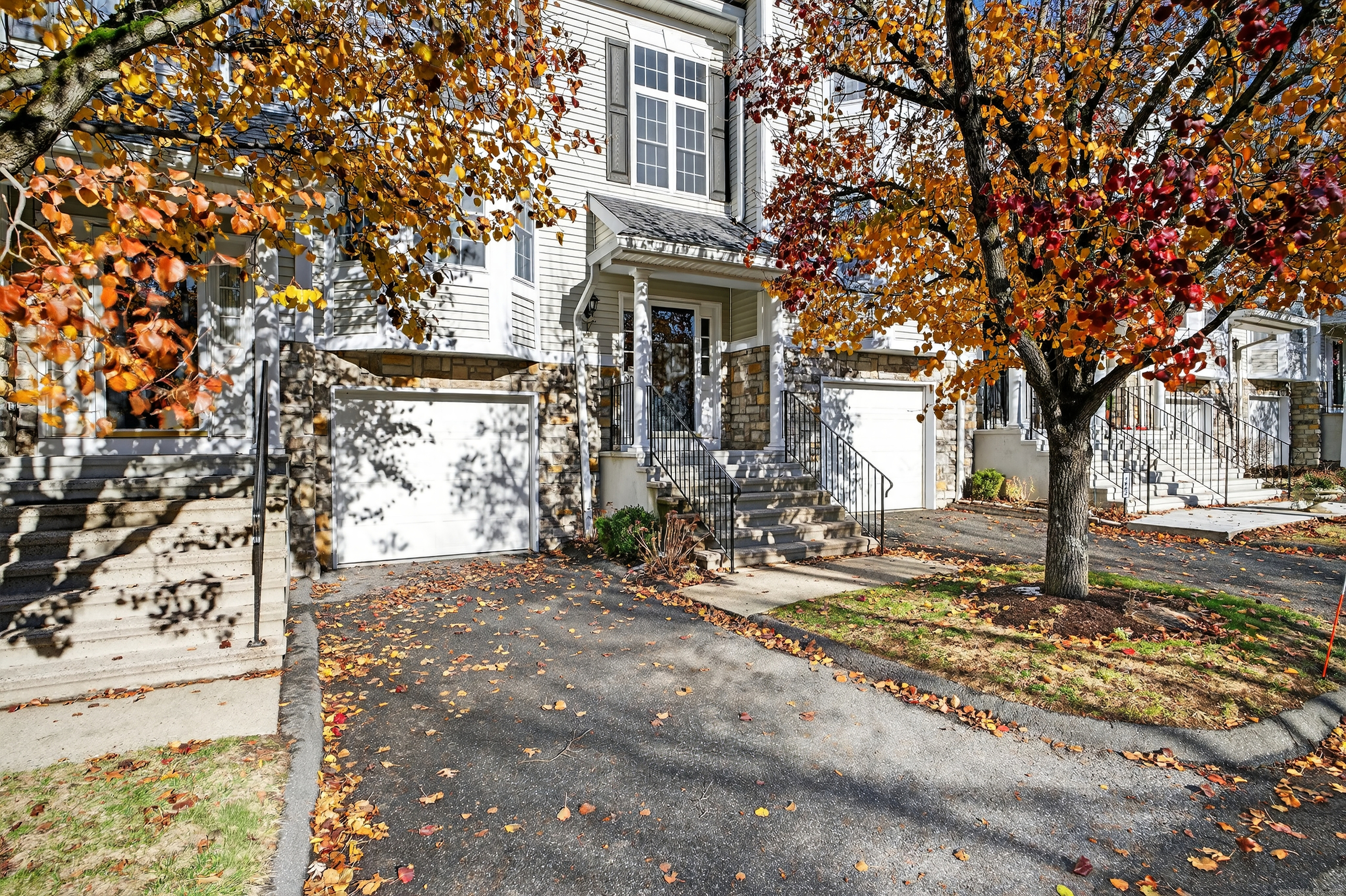 1902 Revere Road, Unit 1902 Danbury, CT 06811 - Photo 33 of 37 a front view of a house with a yard
