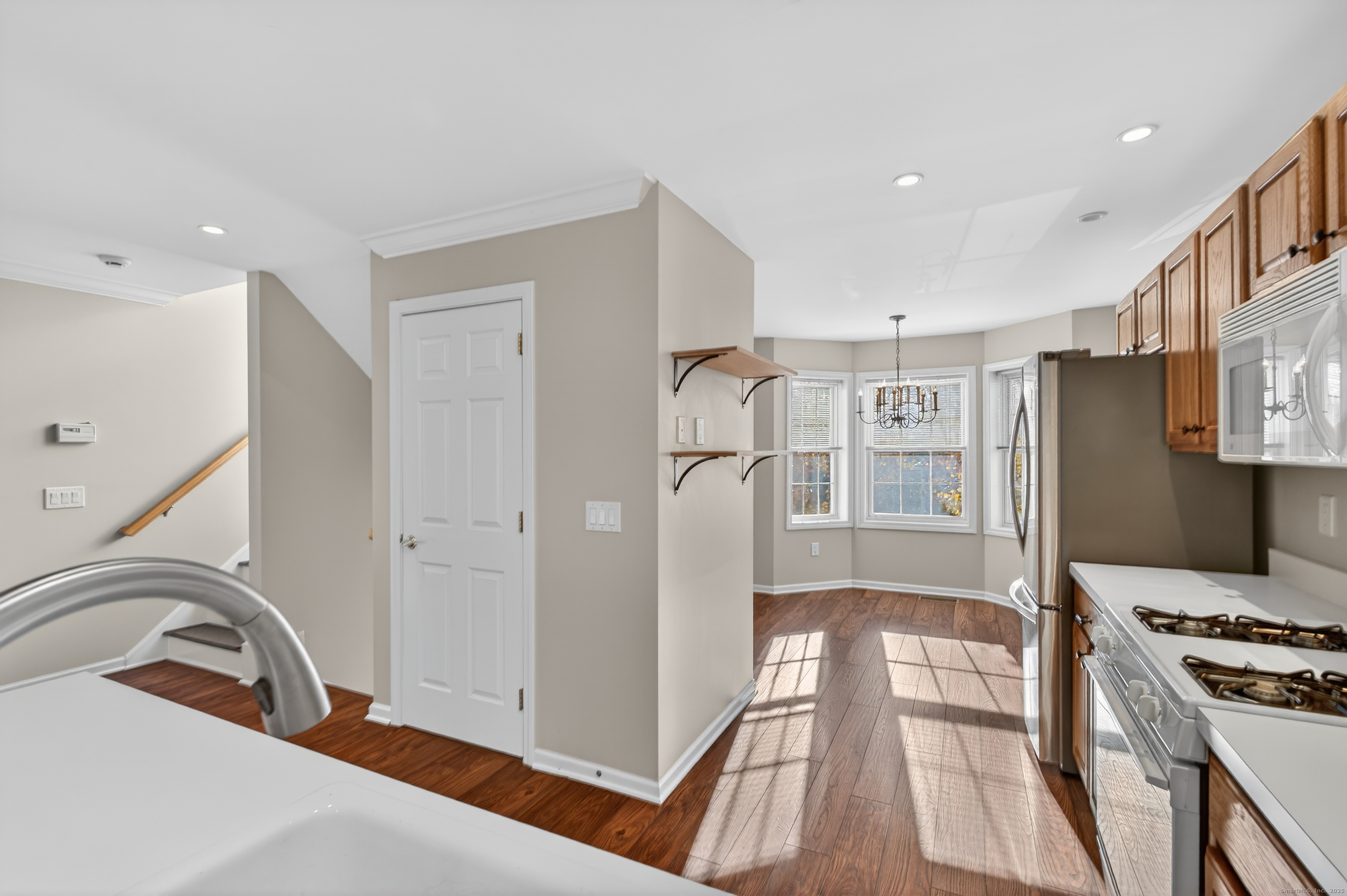 1902 Revere Road, Unit 1902 Danbury, CT 06811 - Photo 5 of 37 a kitchen with stainless steel appliances granite countertop a refrigerator and a stove top oven