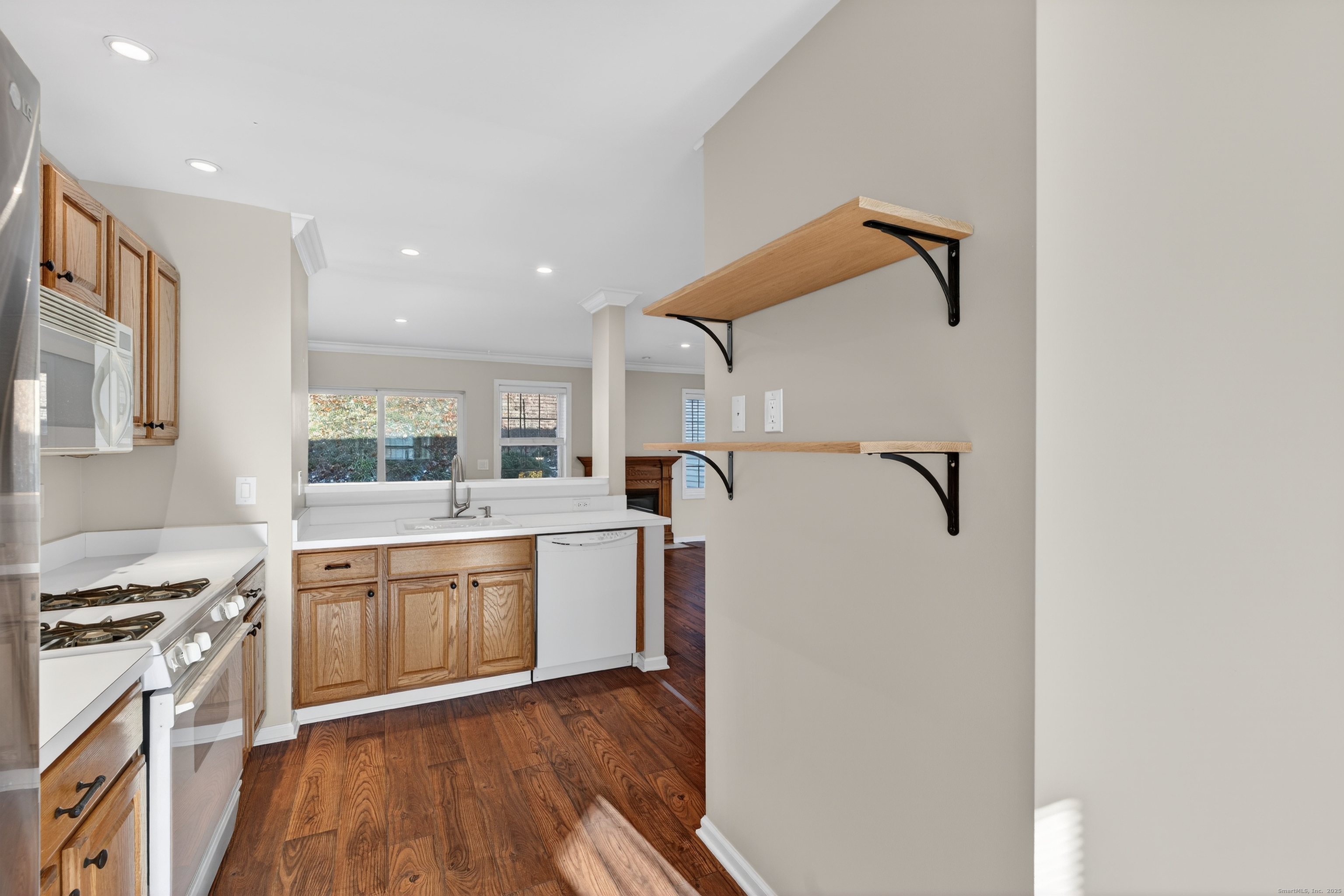 1902 Revere Road, Unit 1902 Danbury, CT 06811 - Photo 7 of 37 a large kitchen with stainless steel appliances granite countertop a stove and a refrigerator