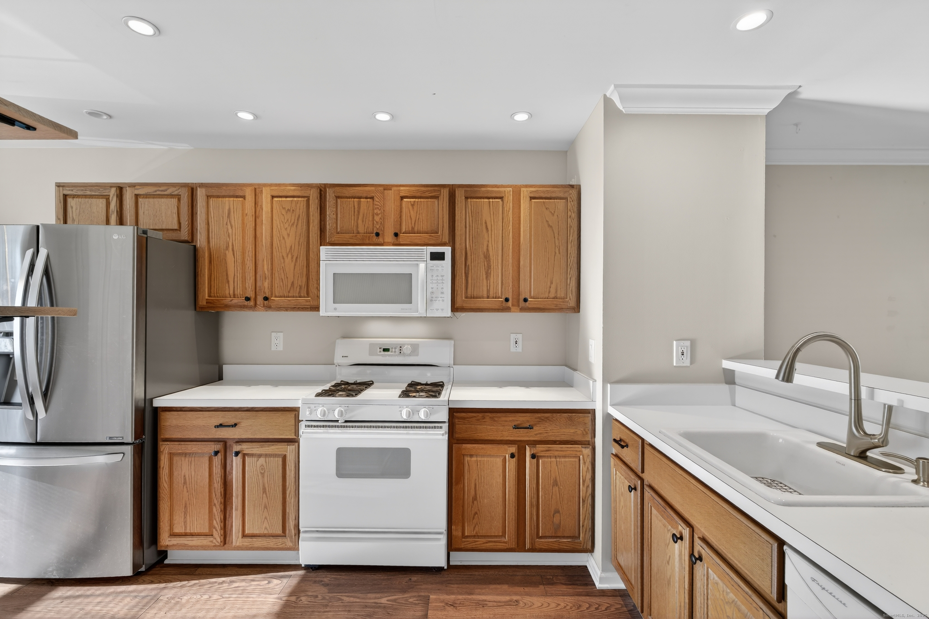 1902 Revere Road, Unit 1902 Danbury, CT 06811 - Photo 8 of 37 a kitchen with a sink stove and refrigerator