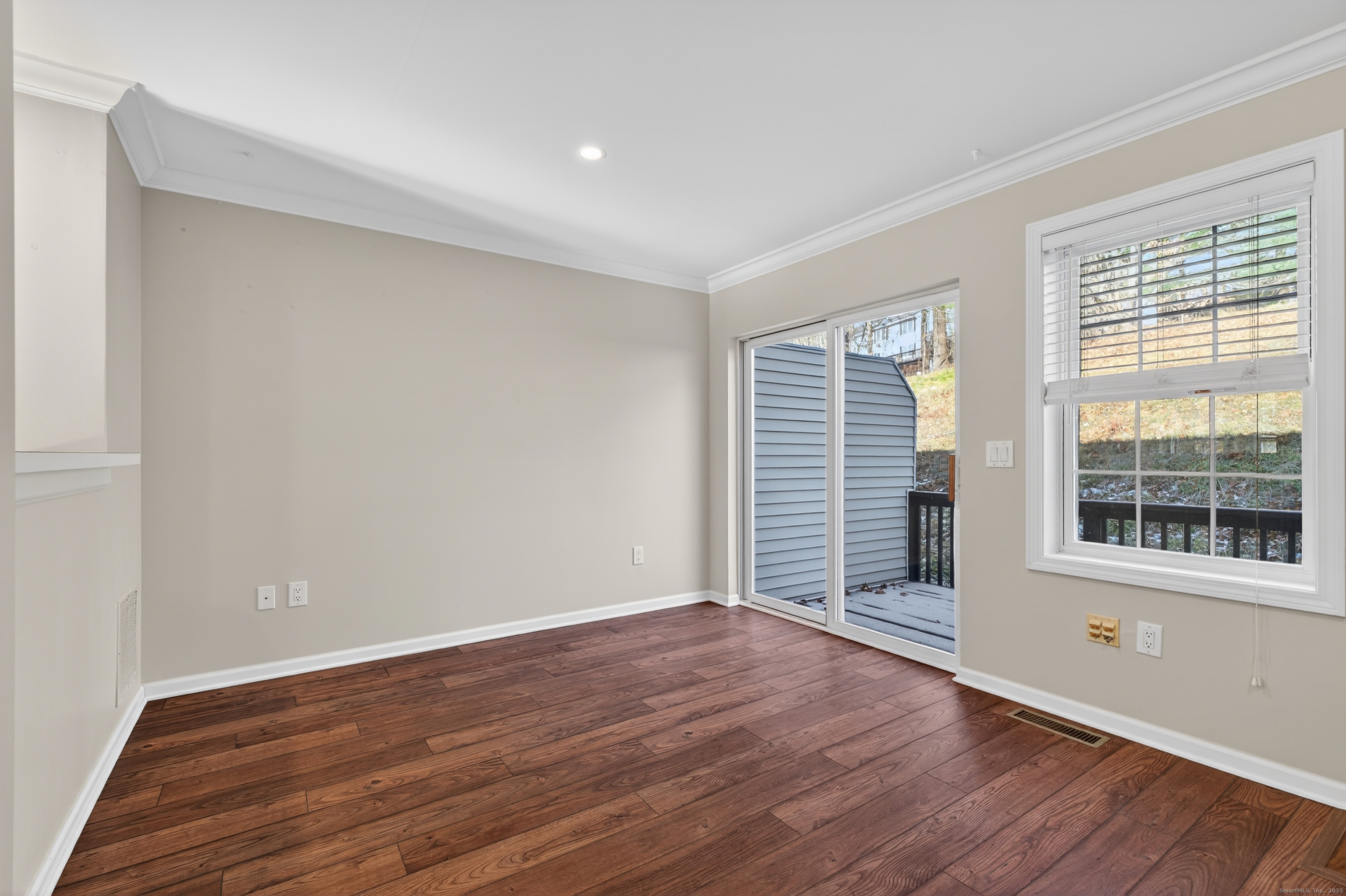 1902 Revere Road, Unit 1902 Danbury, CT 06811 - Photo 10 of 37 a view of wooden floor and windows in a room