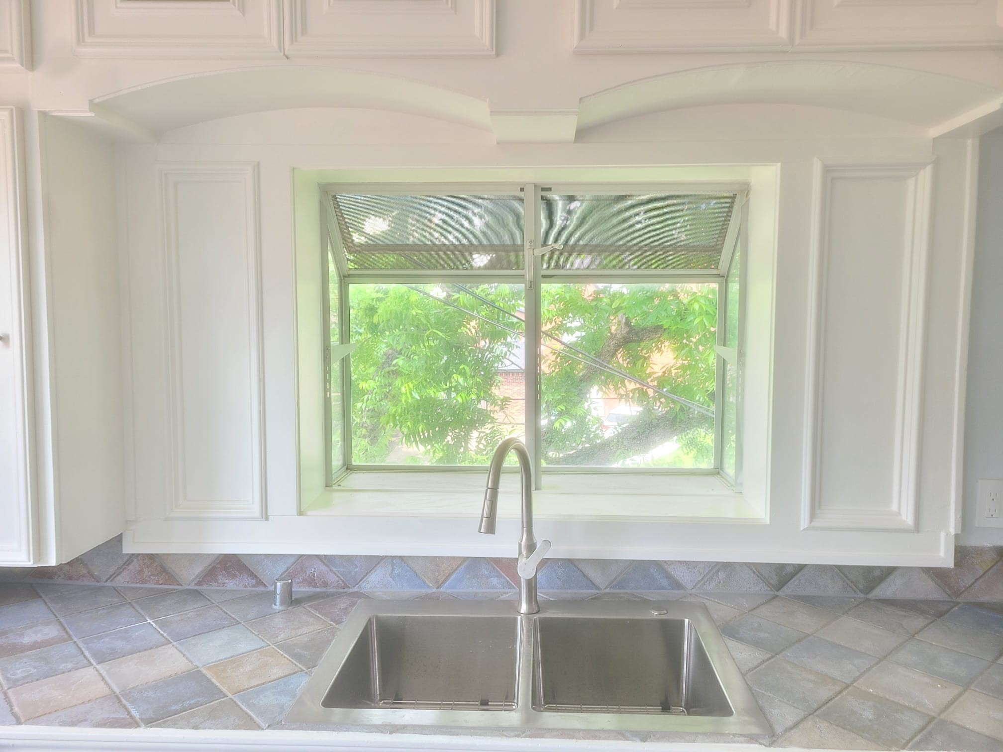 4703 Chenevert Street, Unit 2 Houston, TX 77004 - Photo 11 of 22 a kitchen with a sink and large window