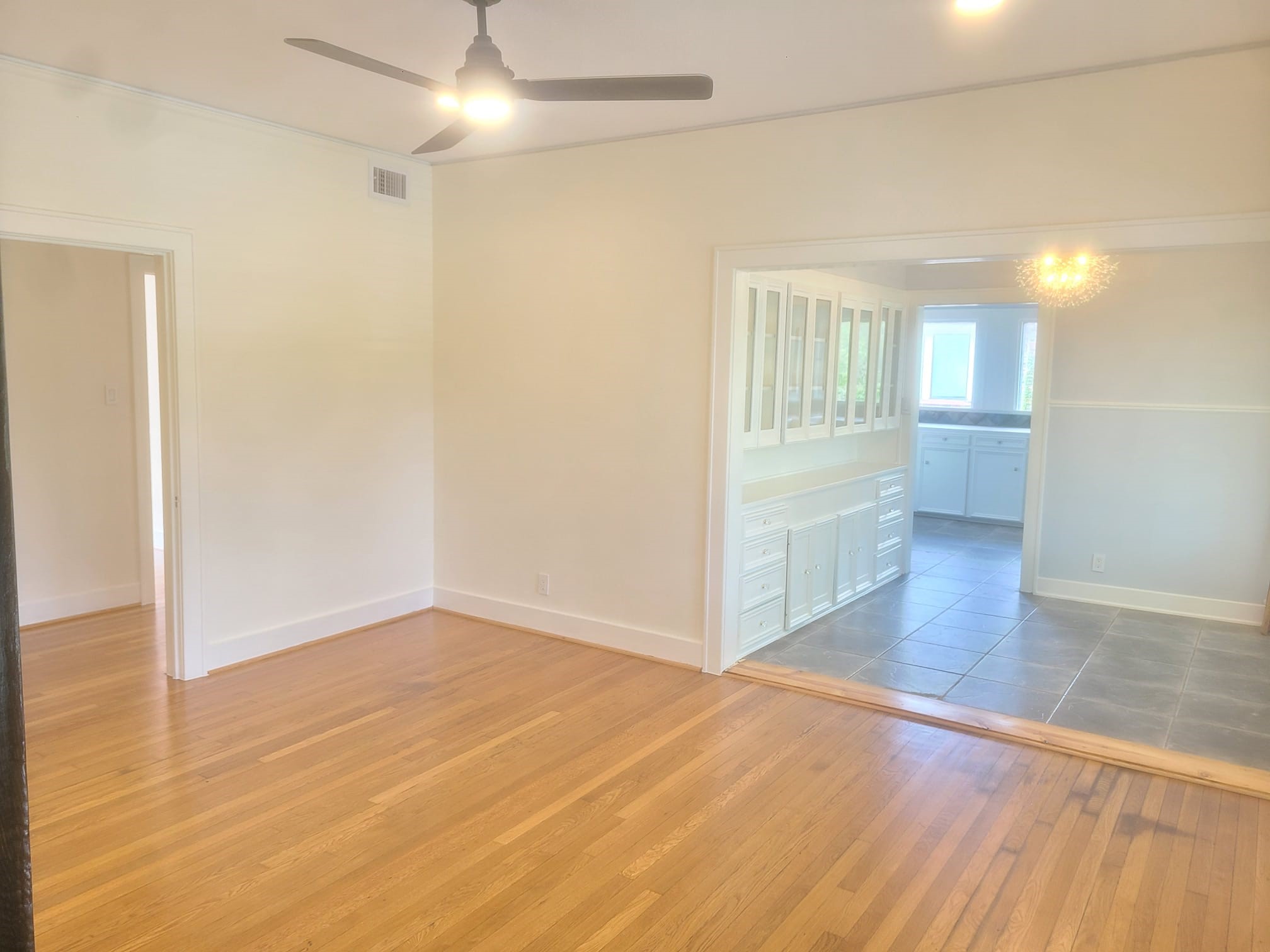 4703 Chenevert Street, Unit 2 Houston, TX 77004 - Photo 18 of 22 an empty room with wooden floor and windows