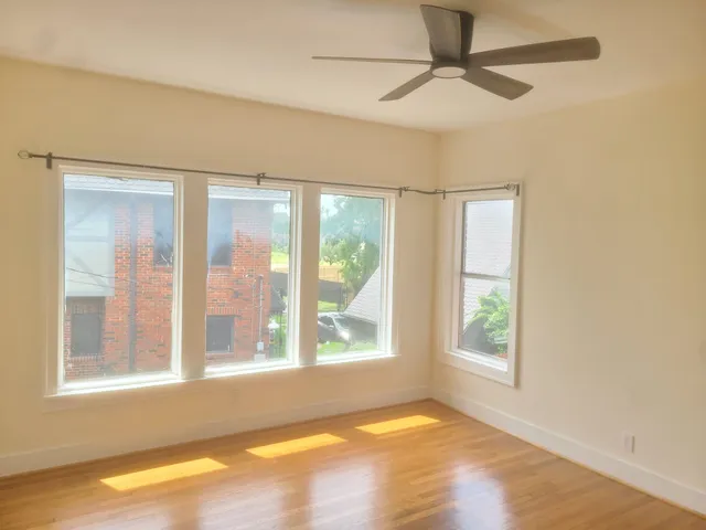 a view of an empty room with a window