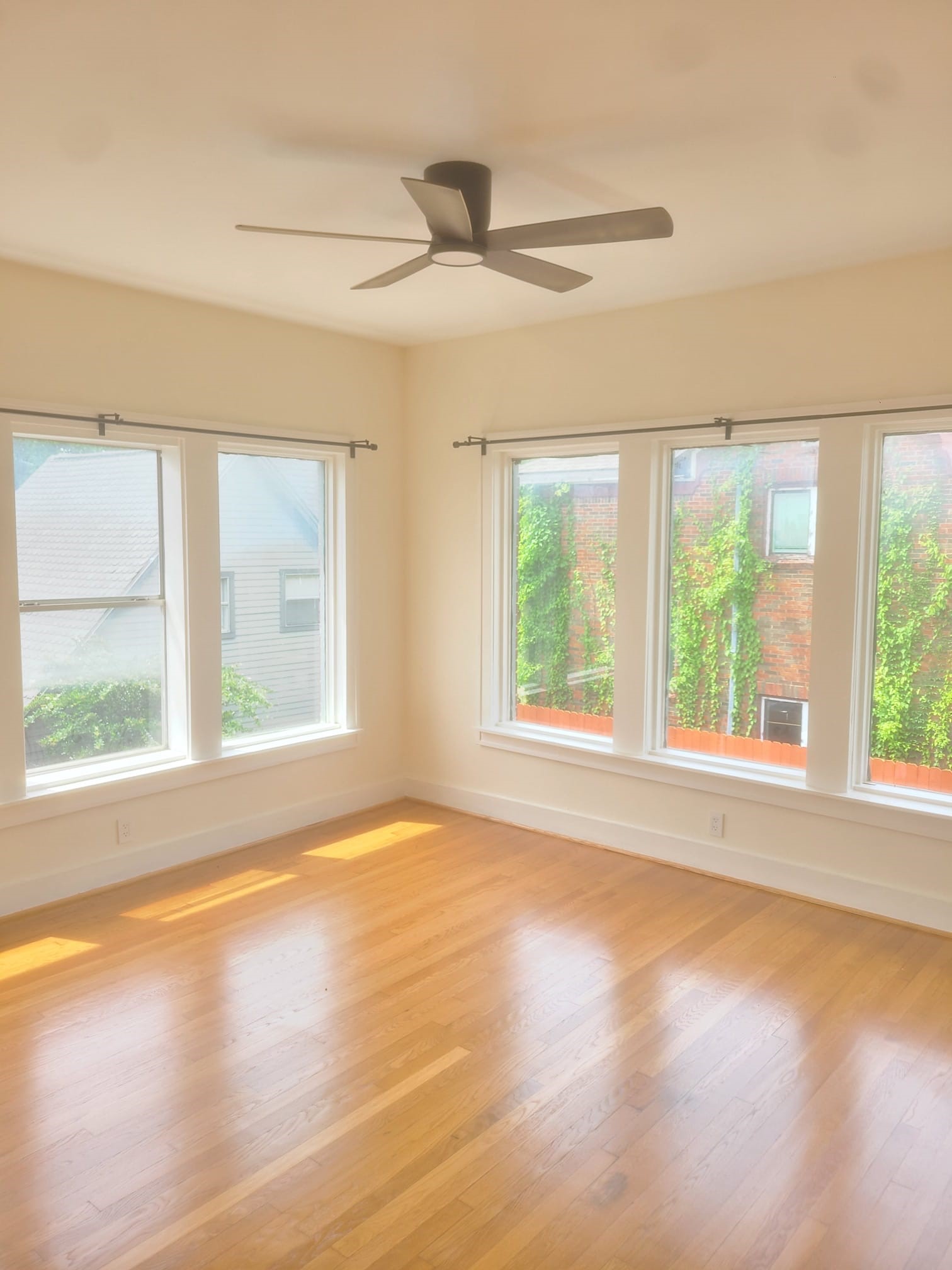 4703 Chenevert Street, Unit 2 Houston, TX 77004 - Photo 6 of 22 a view of an empty room with a window and wooden floor