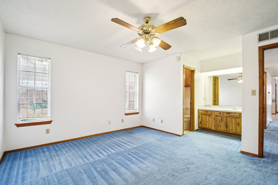102 Stubblefield Drive Elgin, TX 78621 - Photo 17 of 39 a view of an empty room with a window and wooden floor