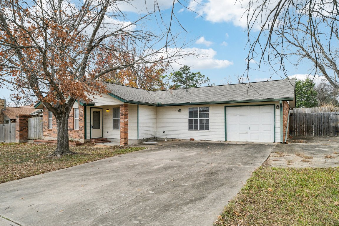102 Stubblefield Drive Elgin, TX 78621 - Photo 3 of 39 a front view of a house with a yard