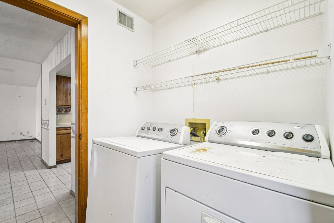 102 Stubblefield Drive Elgin, TX 78621 - Photo 31 of 39 a utility room with dryer and washer