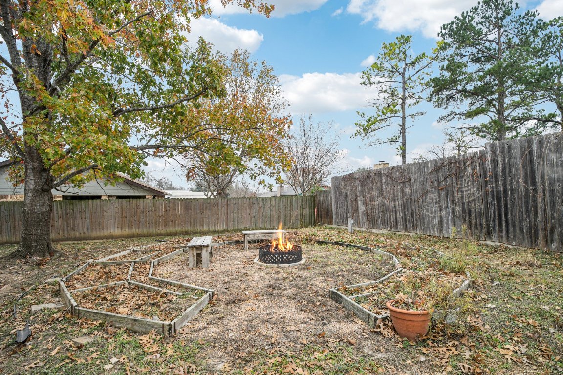 102 Stubblefield Drive Elgin, TX 78621 - Photo 39 of 39 a backyard of a house with table and chairs