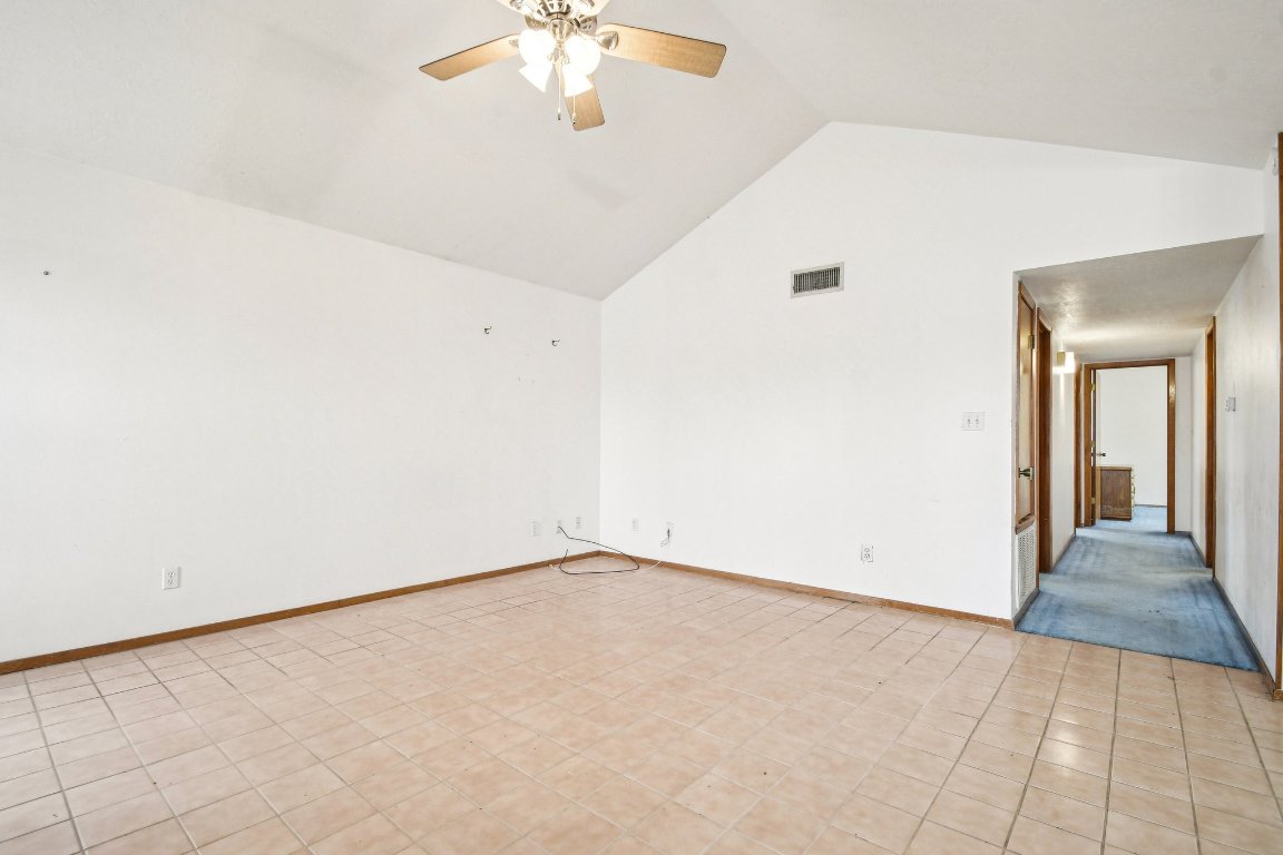 102 Stubblefield Drive Elgin, TX 78621 - Photo 9 of 39 an empty room with chandelier fan