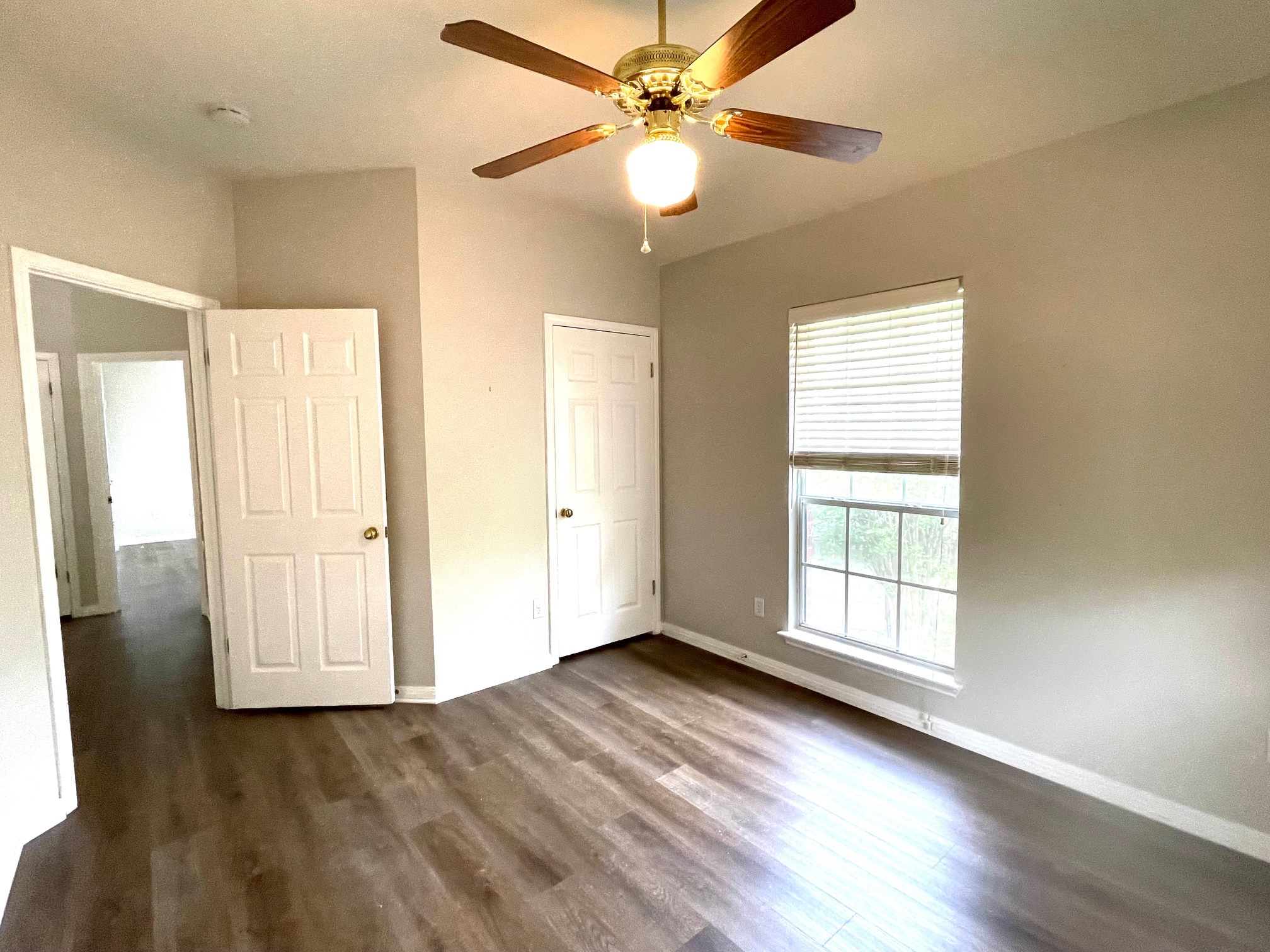8504 Ephraim Road Austin, TX 78717 - Photo 15 of 16 Unfurnished bedroom featuring dark wood-style flooring and ceiling fan