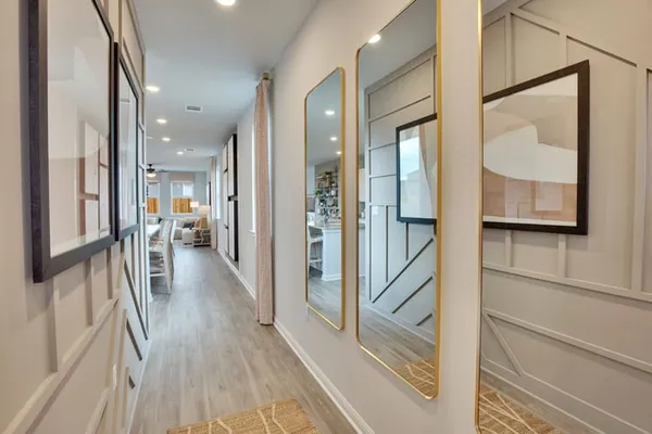 a view of a hallway view with wooden floor and staircase
