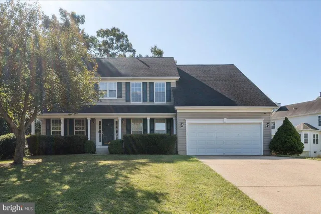 a front view of a house with yard