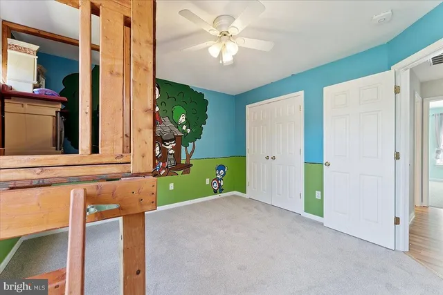 a bathroom with a sink mirror vanity and toilet