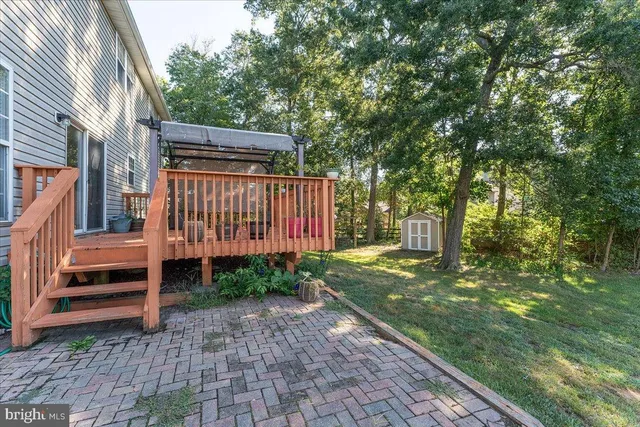 a view of a porch with wooden floor
