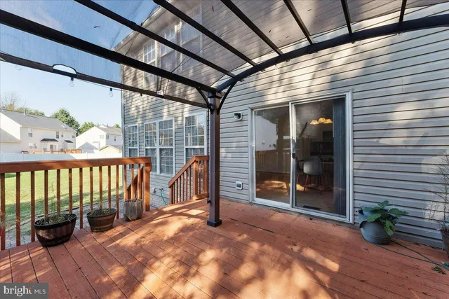 a view of a house with yard and tree s