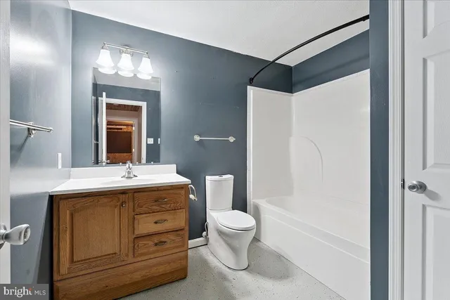 an aerial view of a house with a yard pool patio and outdoor seating