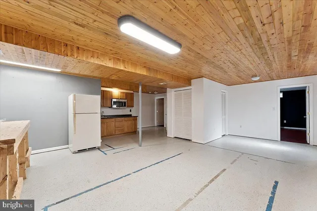 an aerial view of a houses with yard