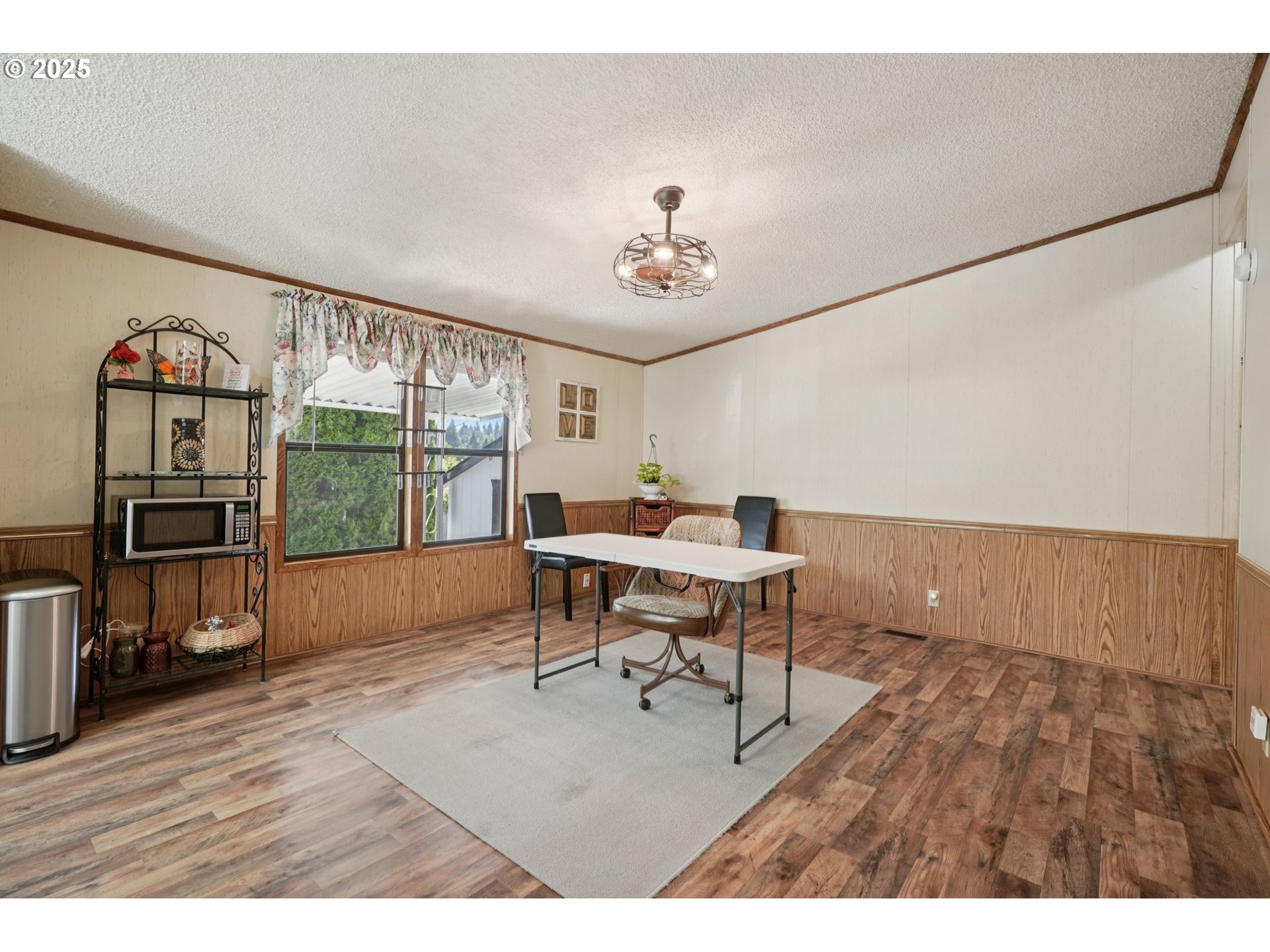 8434 Heritage Court, Unit 19 Clackamas, OR 97015 - Photo 11 of 28 a workspace with furniture window and wooden floor