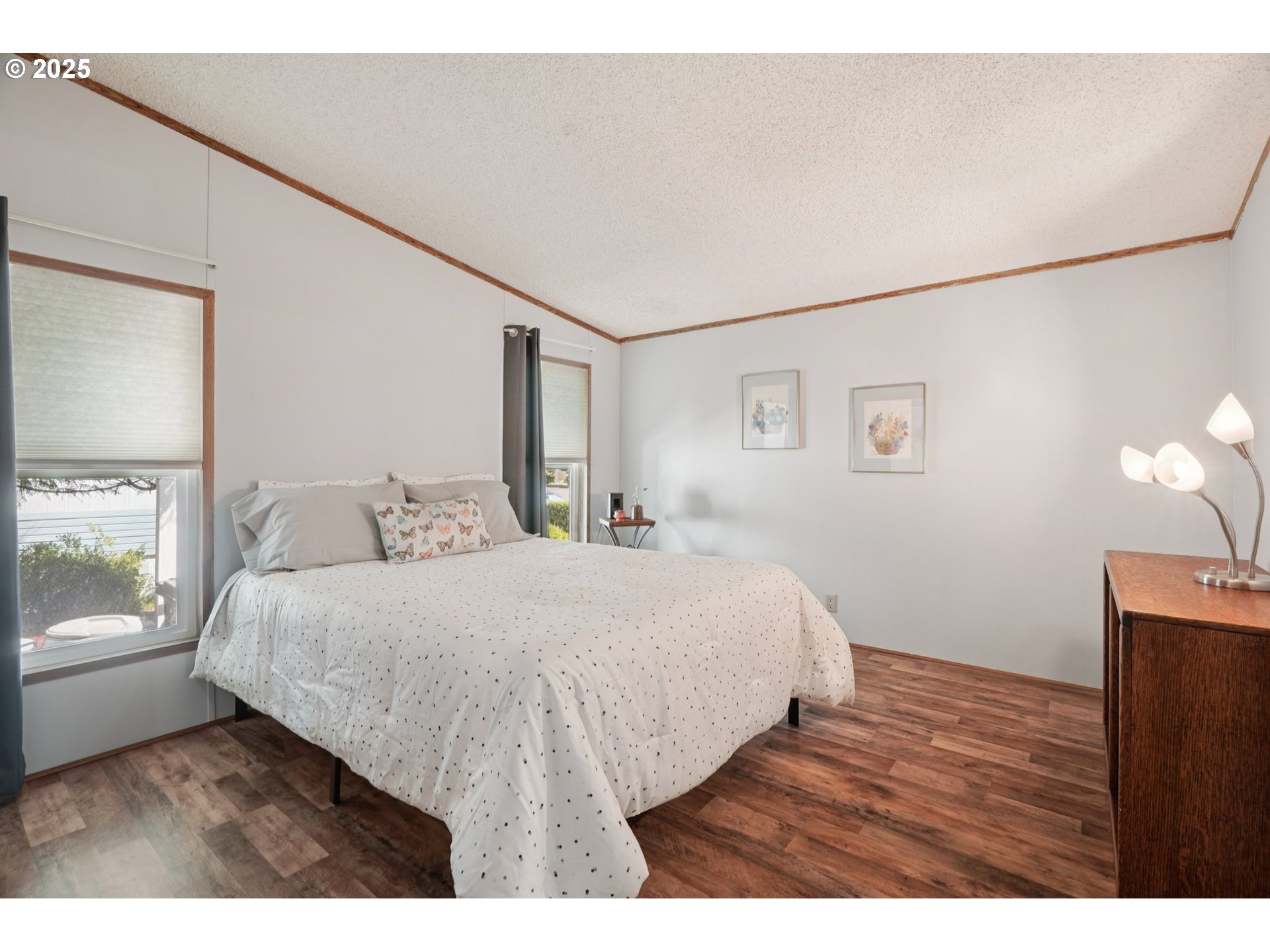 8434 Heritage Court, Unit 19 Clackamas, OR 97015 - Photo 12 of 28 a bedroom with a bed and a window
