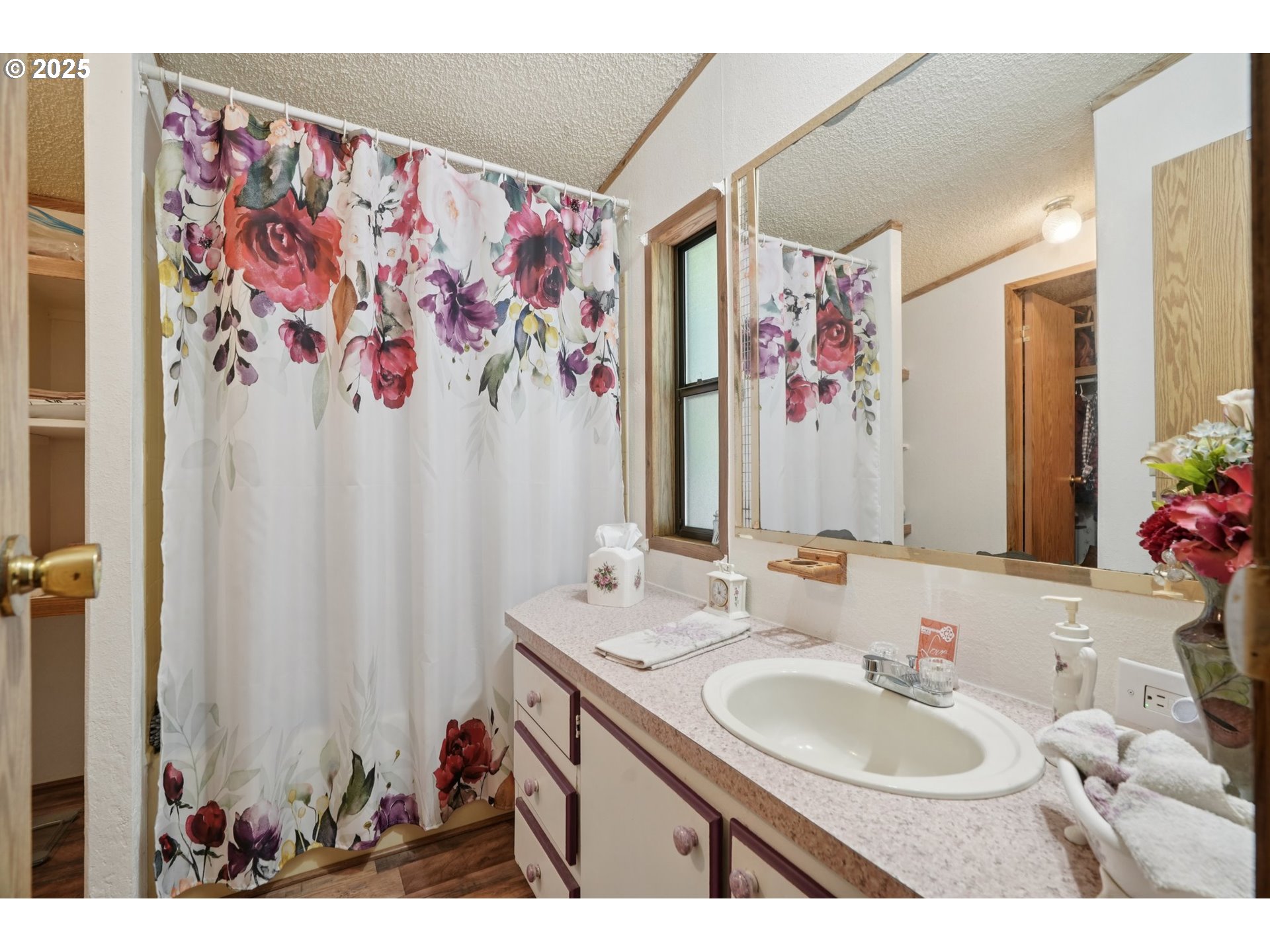 8434 Heritage Court, Unit 19 Clackamas, OR 97015 - Photo 14 of 28 a bathroom with a sink vanity and a mirror