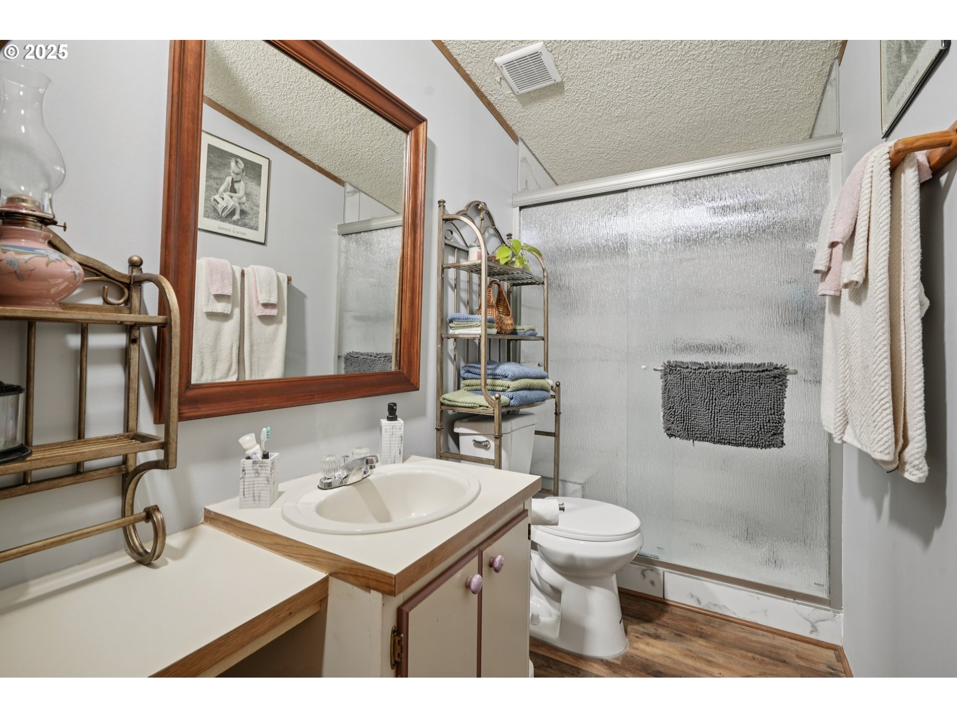8434 Heritage Court, Unit 19 Clackamas, OR 97015 - Photo 16 of 28 a bathroom with a sink a toilet and shower