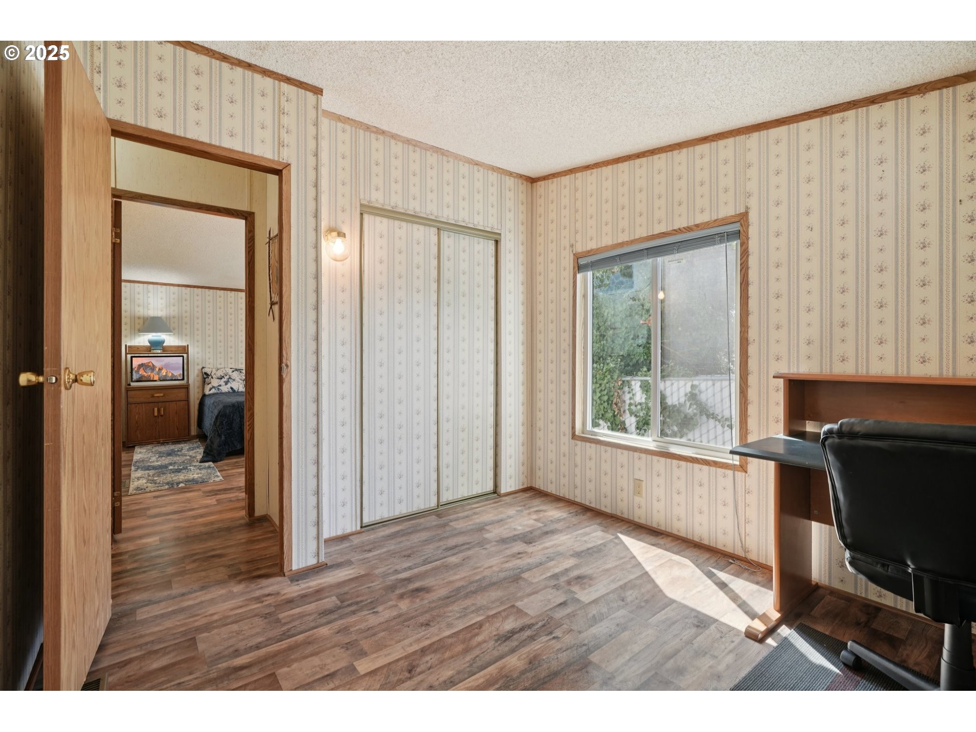 8434 Heritage Court, Unit 19 Clackamas, OR 97015 - Photo 17 of 28 a view of an empty room with a window